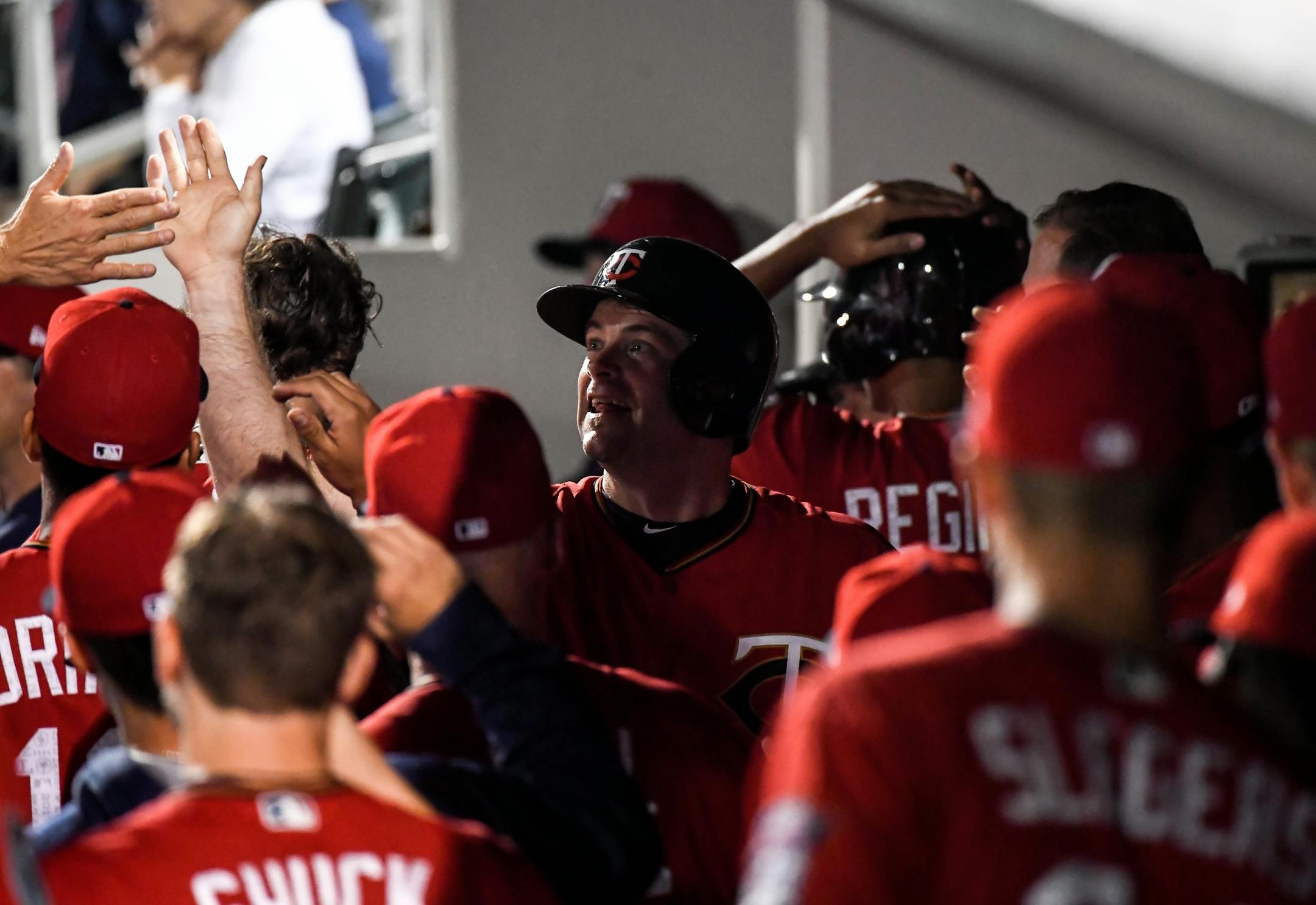 Twins infielder Matt Hague celebrated with teammates after scoring in the bottom of the ninth inning off a hit by Benji Gonzalez.
