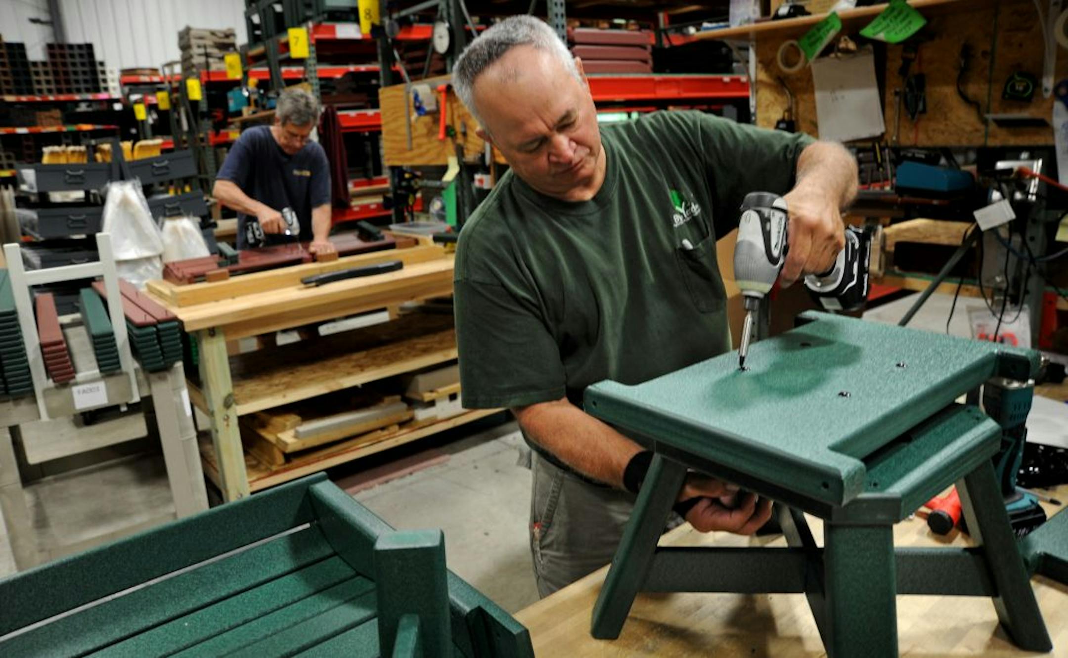 Dan Lyter assembled a swivel dinning chair on the assembly floor of By The Yard of Jordan, Minn. With the comeback of the Made In The U.S.A campaign in which consumers buy only goods made in the U.S. By The Yard, makes durable patio furniture out of recycled milk jugs. Customers call frequently to ask if products are made in the U.S. Sales are up 20-30% each year. Company just added a night shift to keep up with demand.