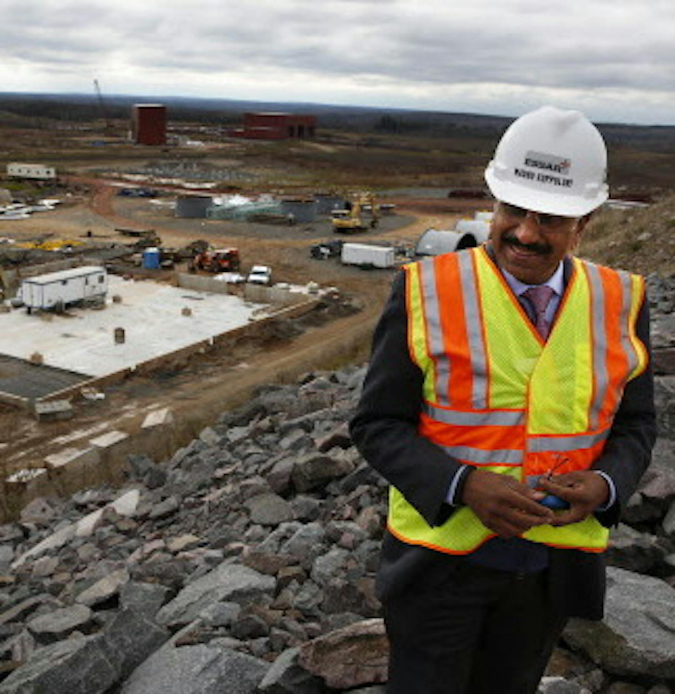 Madhu Vuppuluri, president and CEO of Essar Steel Minnesota, looks over the Essar Project in Nashwauk, Minn. Essar Steel Minnesota recently ramped up construction on an $1.8 billion taconite plant after securing the funding needed to complete the project. ] LEILA NAVIDI leila.navidi@startribune.com / BACKGROUND INFORMATION: Thursday, October 30, 2014. The plant endured several delays over the past two years as funds periodically ran dry and some contractors were paid late and walked off the job.