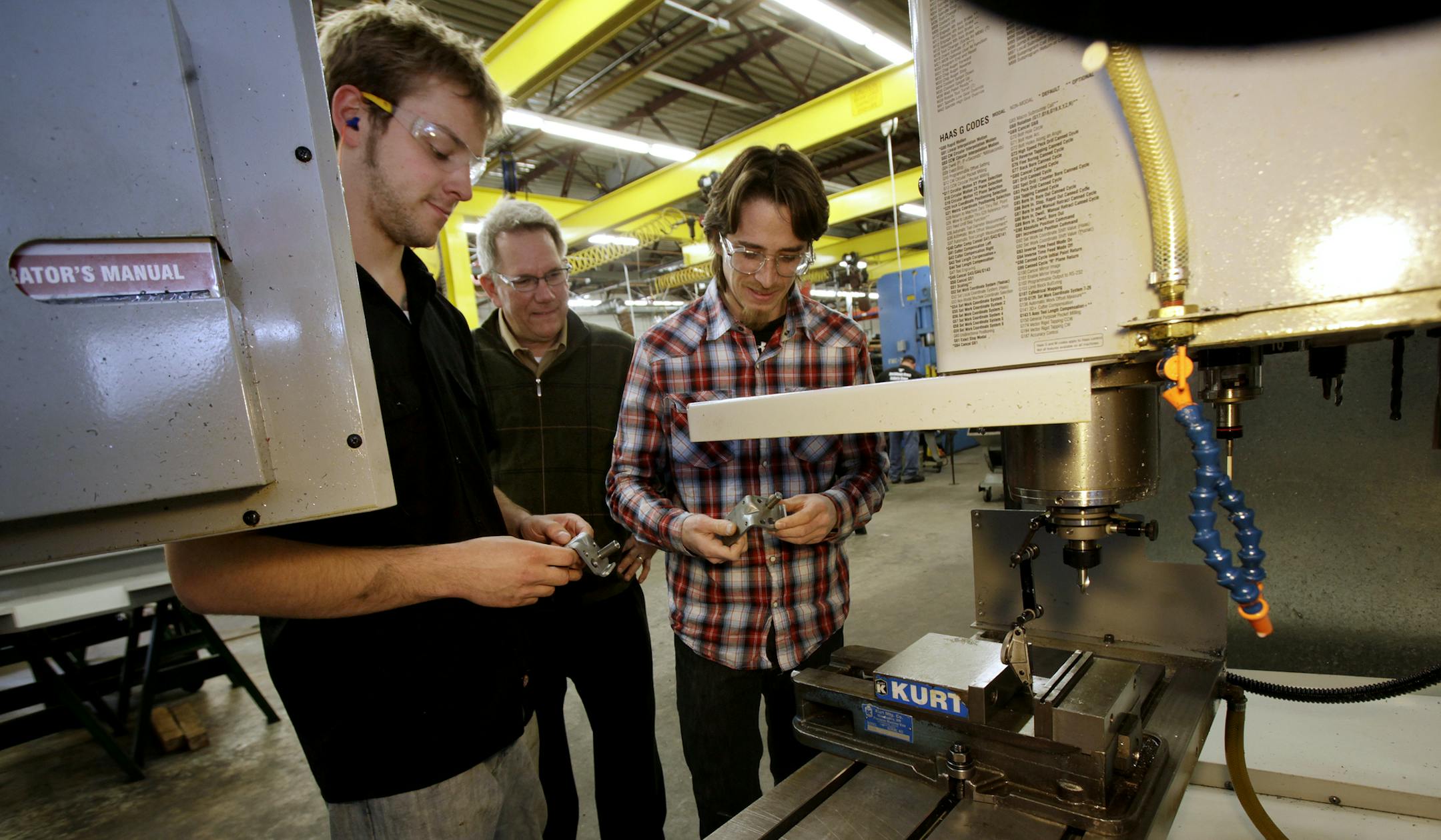 Technical blue-collar jobs pay far above what can be earned in a non-STEM field. Dunwoody College of Technology interns Joe Brudzinski, left, and Talon Ganz talked with Erick Ajax, co-owner of E.J. Ajax & Sons Inc., in March. JOEL KOYAMA Star Tribune