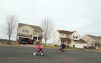 Finley, Brown 4, left and her brother Noah, 6, rode their bikes in a their cul-de-sac.
