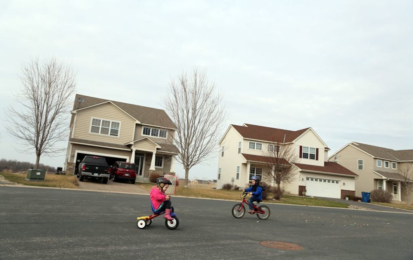 Finley, Brown 4, left and her brother Noah, 6, rode their bikes in a their cul-de-sac.