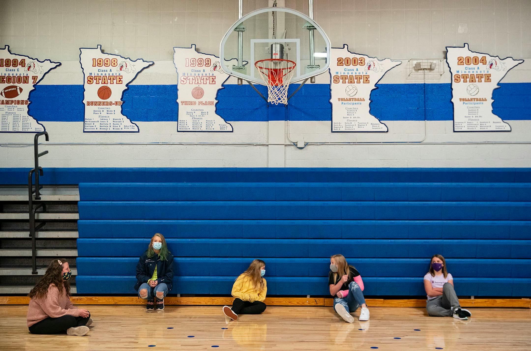 A group of seventh grade girls talked to each other while maintaining social distancing in the Carlton High School gymnasium on Tuesday.
