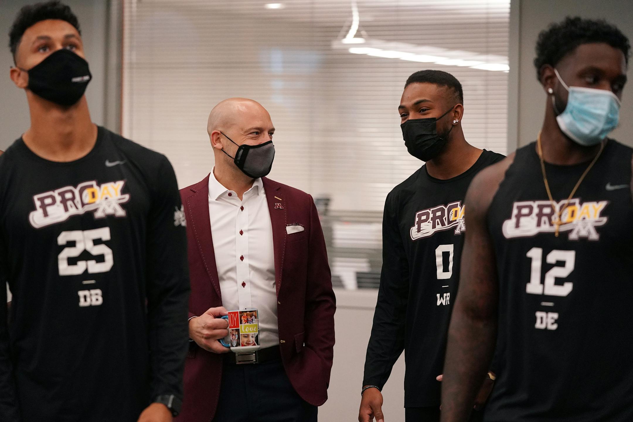 University of Minnesota head football coach P.J. Fleck talked with wide receiver Rashod Bateman during Pro Day.