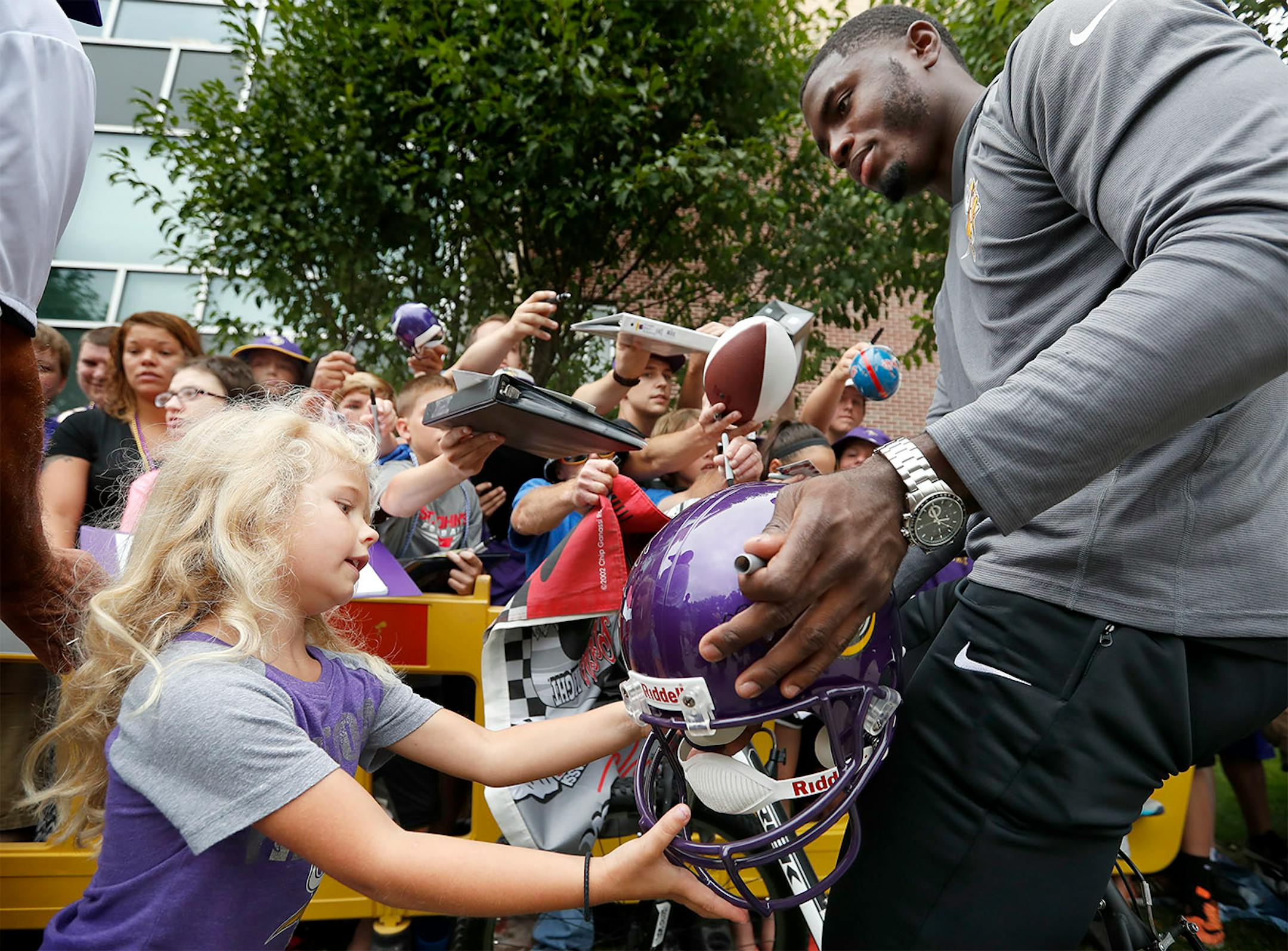 Minnesota Vikings first round draft pick Laquon Treadwell signed an autograph for Tatum Smith, 5 of Lakeville.