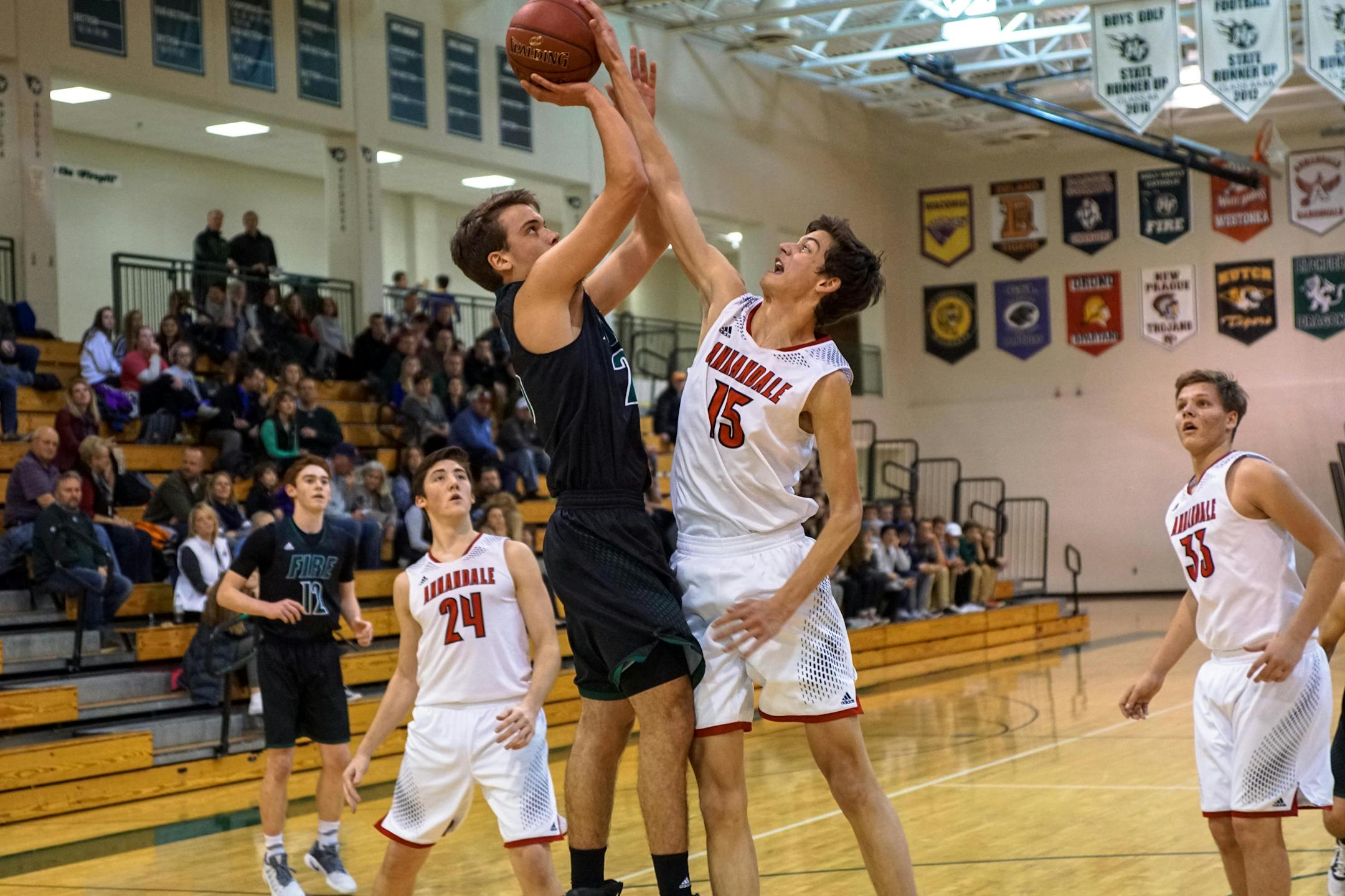 Trent Peper (15) is one of four Cardinals who averages in double figures. He is also one of the team's top three-point shooters.