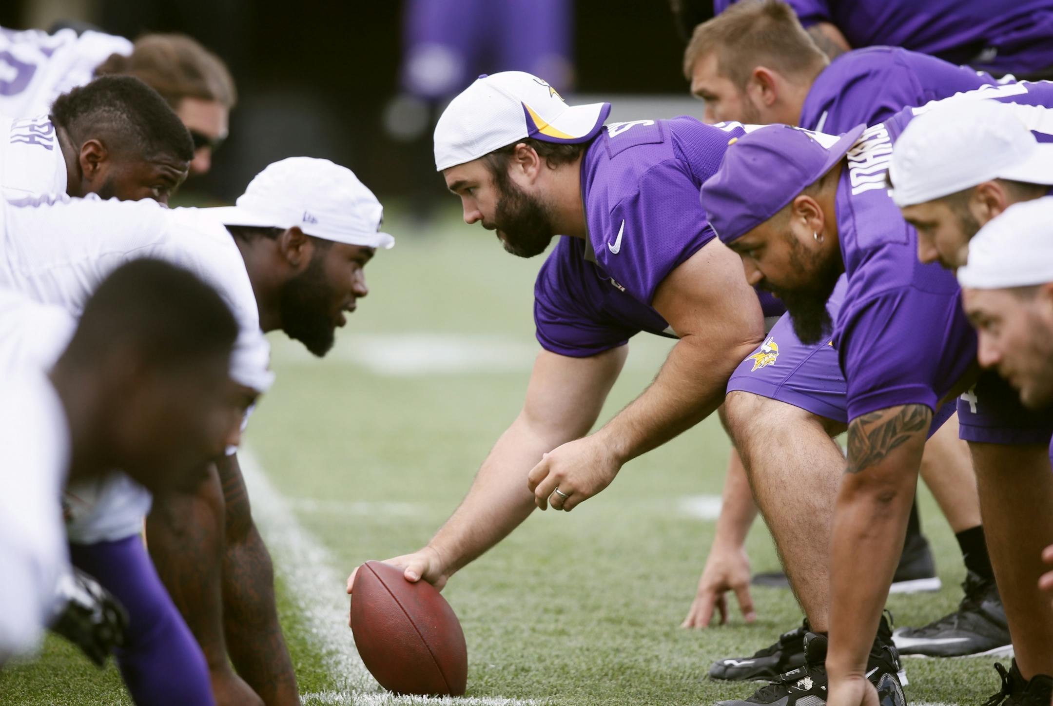 Vikings center John Sullivan and the rest of the offensive line ran though drills during NFL camp at Minnesota State ,Mankato Sunday July 27, 2014 in Mankato, MN .
