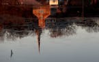 Instead of sitting out the pandemic winter, Stillwater — reflected Tuesday in the St. Croix River — has decided to decorate and plan low-key outdo