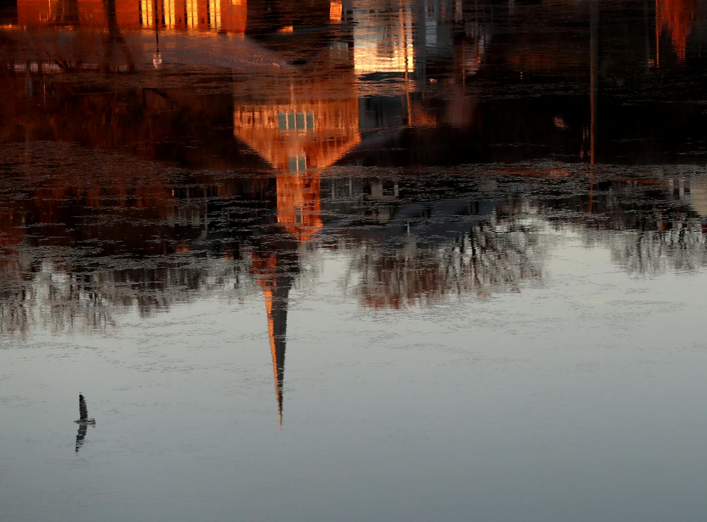 Instead of sitting out the pandemic winter, Stillwater — reflected Tuesday in the St. Croix River — has decided to decorate and plan low-key outdoor fun.