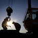 Iron workers set up a crane to move steel for the construction of buildings on the site of Essar Steel Minnesota's taconite mine project in Nashwauk, 