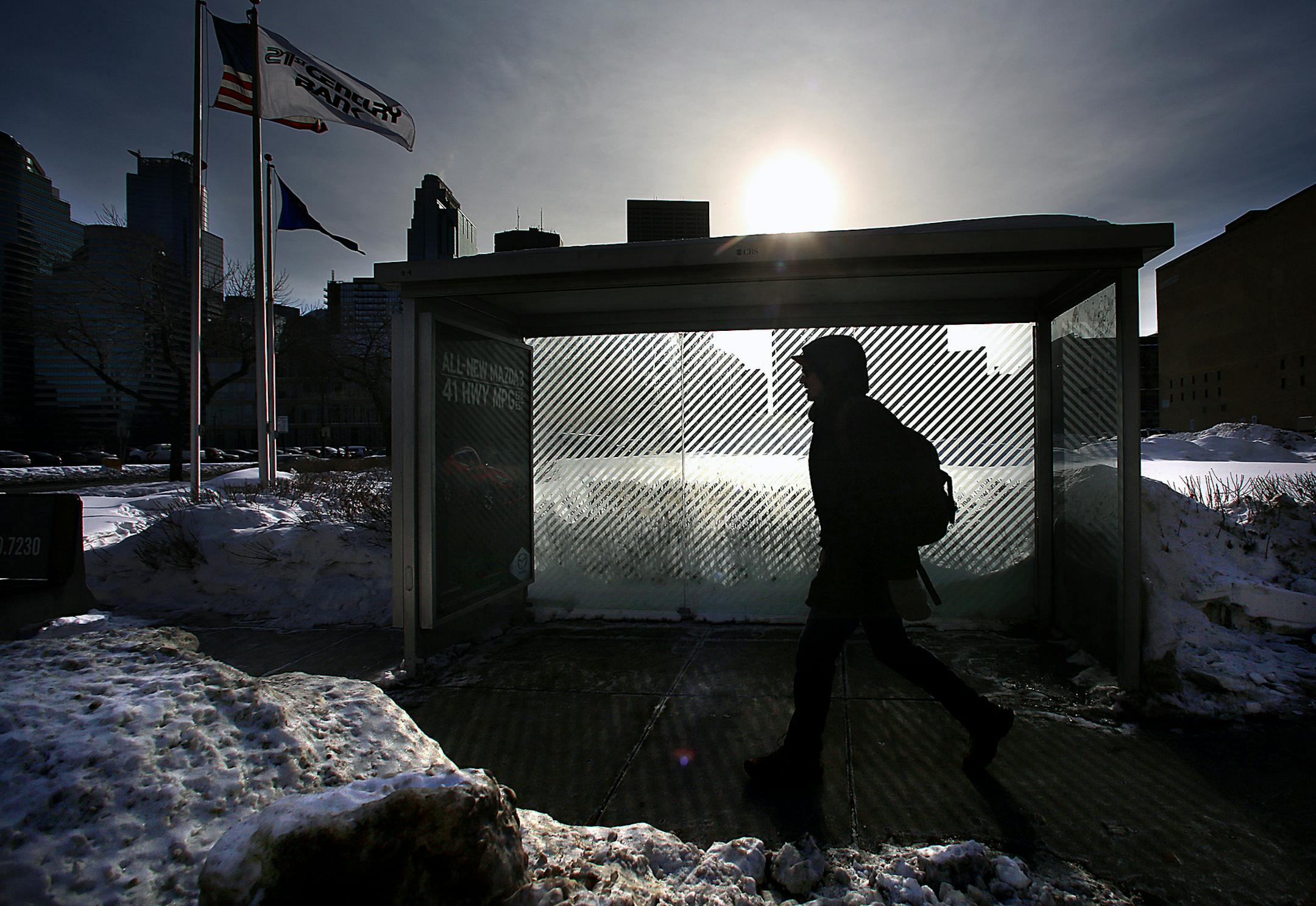 A pedestrian walked past a bus shelter owned by CBS Outdoor along Washington Ave. S. near Hennepin Ave. ] JIM GEHRZ ‚Ä¢ jgehrz@startribune.com / Minneapolis, MN / February 12, 2014 / 12:00 PM / BACKGROUND INFORMATION: Big cities around the country - from Chicago to Washington, D.C. to Milwaukee - are cutting deals with private companies to handle advertising and maintenance of their bus shelters, generating debates about how public spaces can be revenue-generators and whether th