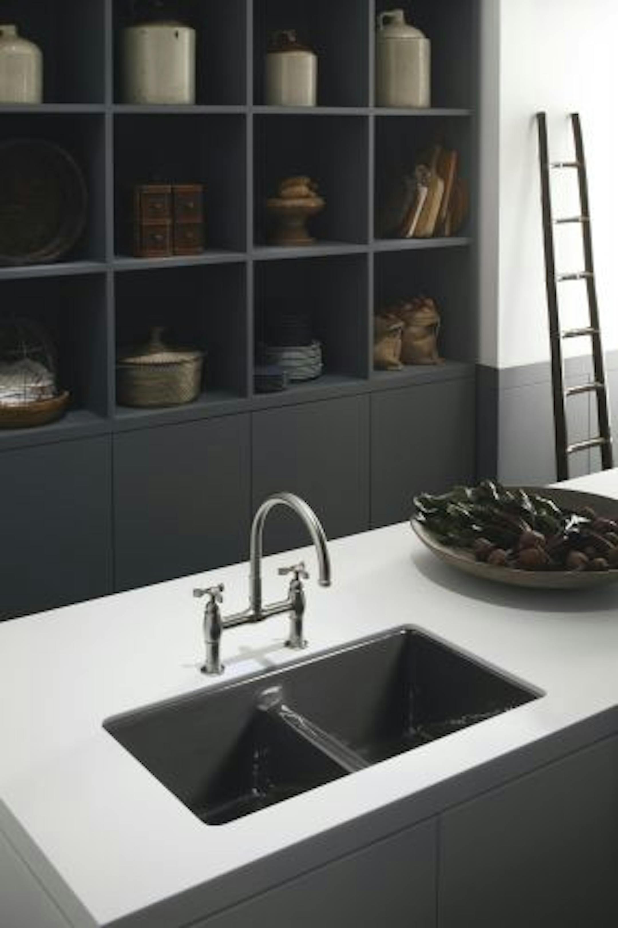 Popular color choices for kitchen fixtures include Caviar — a deep warm gray — and Honed White.