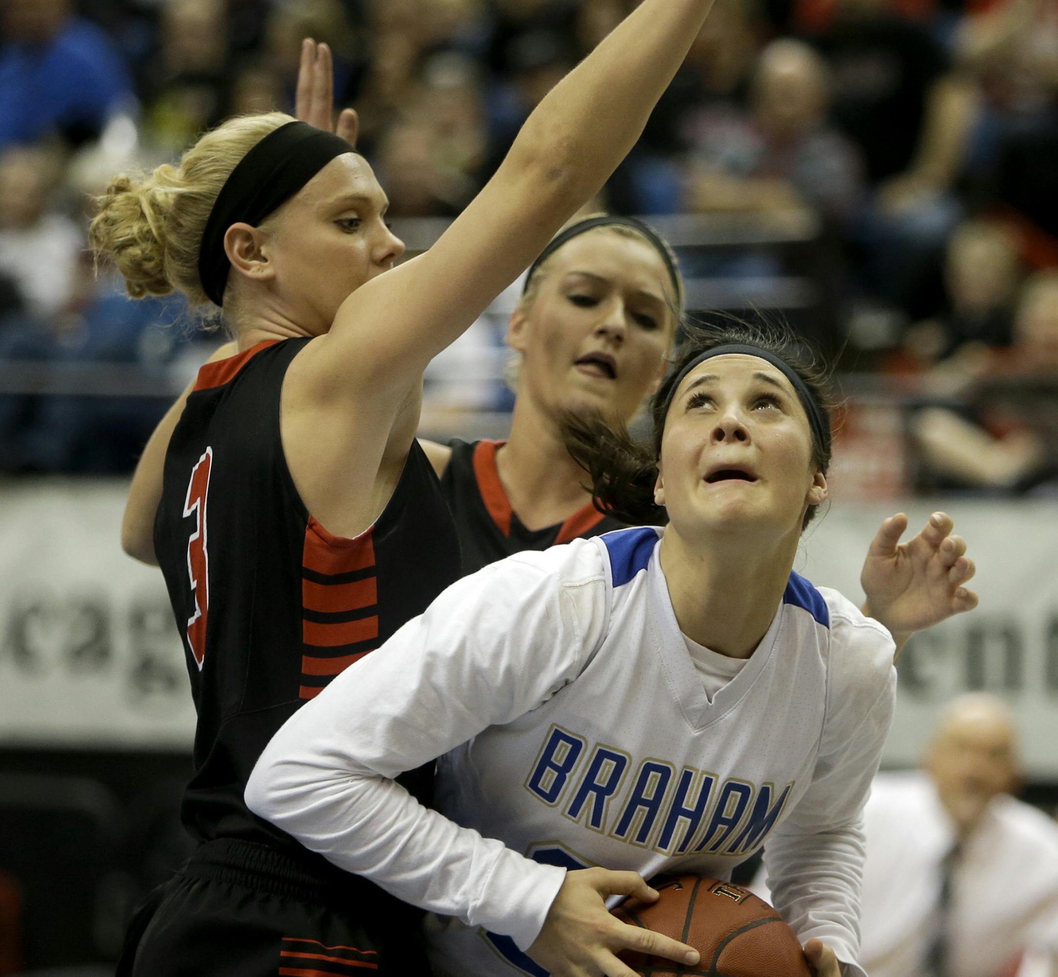Braham's Rebekah Dahlman (25) drives against New Richland H-E-G's Carlie Wagner during the first half of New Richland's dramatic 60-59 win over Braham at the girls basketball state tournament (class 2A) finals Saturday, March 16, 2013, at the Target Center in Minneapolis.] (DAVID JOLES/STARTRIBUNE) djoles@startribune.com girls basketball state tournament (class 2A) finals Saturday, March 16, 2013, at the Target Center in Minneapolis.**Rebekah Dahlman, Carlie Wagner,cq