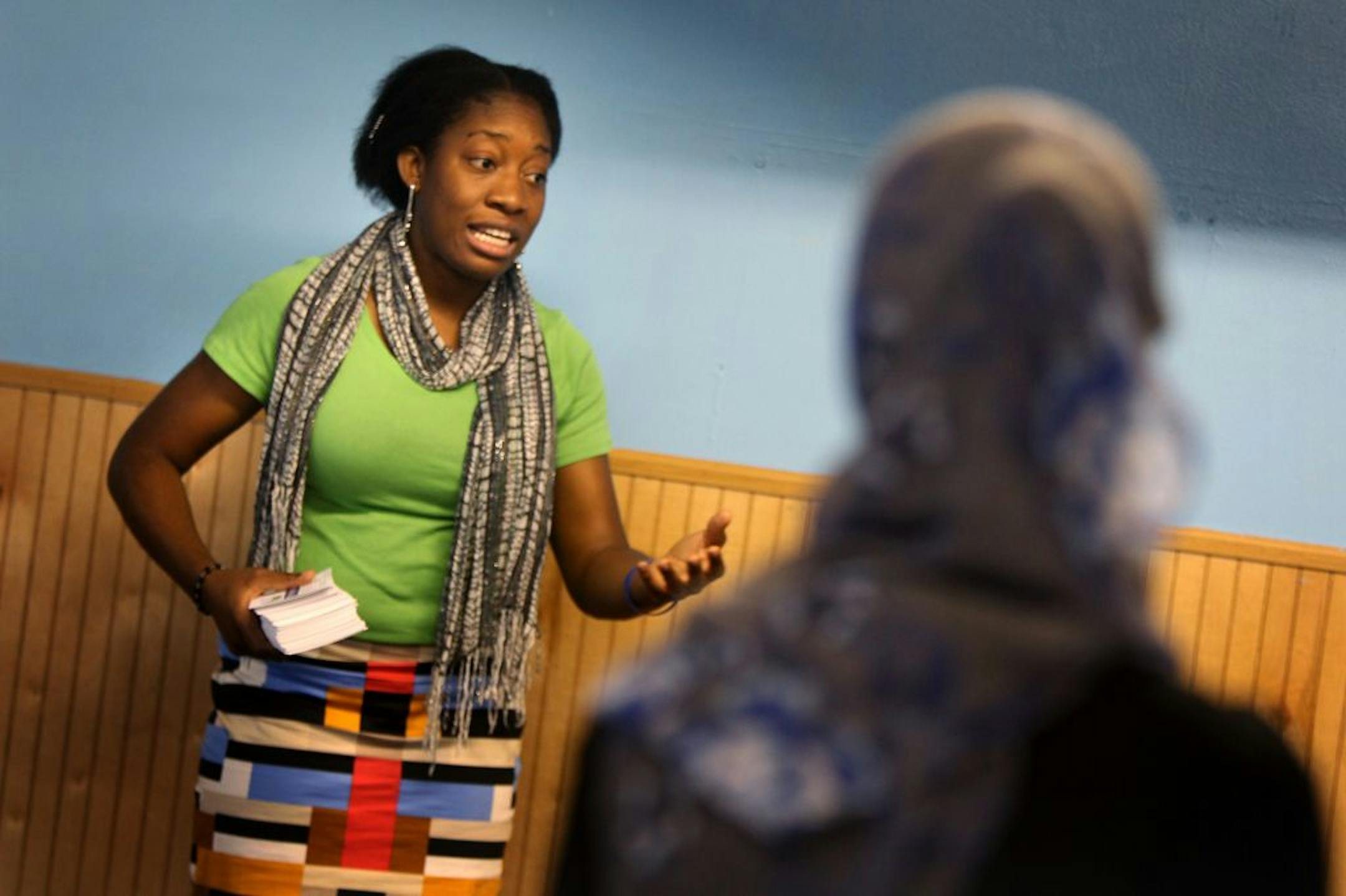 Winnie Okafor, a community relations coordinator with Minnesota for Marriage, the main group in support of the proposed marriage amendment, talked to a group of Muslim women before prayer at the Tawfik Islamic Center.