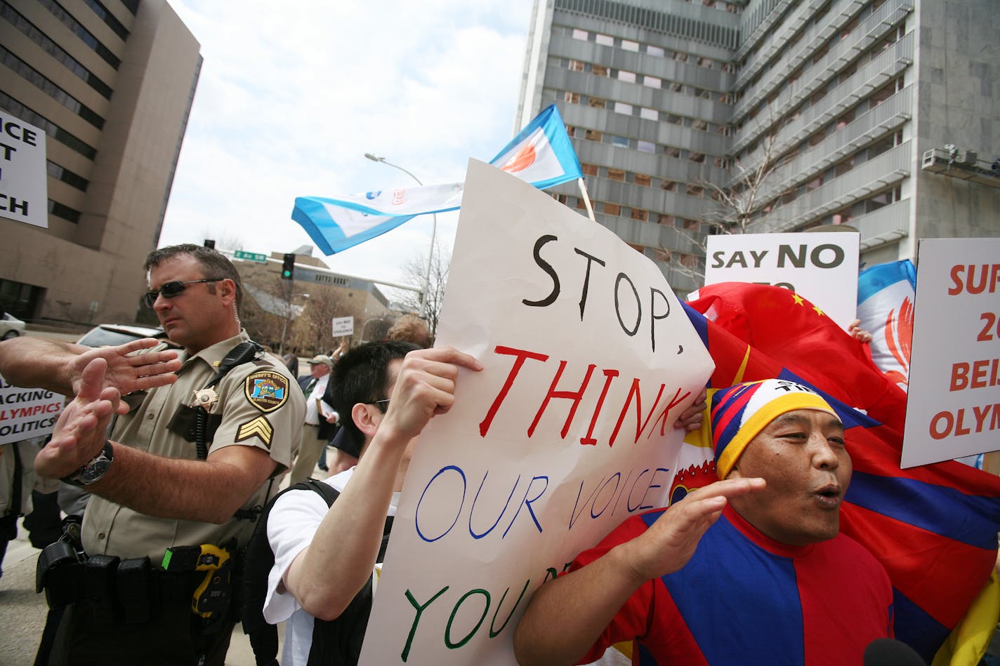 Tenzin Dhangsong of Richfield, a native of Tibet, was surrounded by pro-China demonstrators who protested against the Dalai Lama as he spoke Wednesday at the Mayo Clinic in Rochester. He talked about his mission of moderation and peace, of compassion and forgiveness.