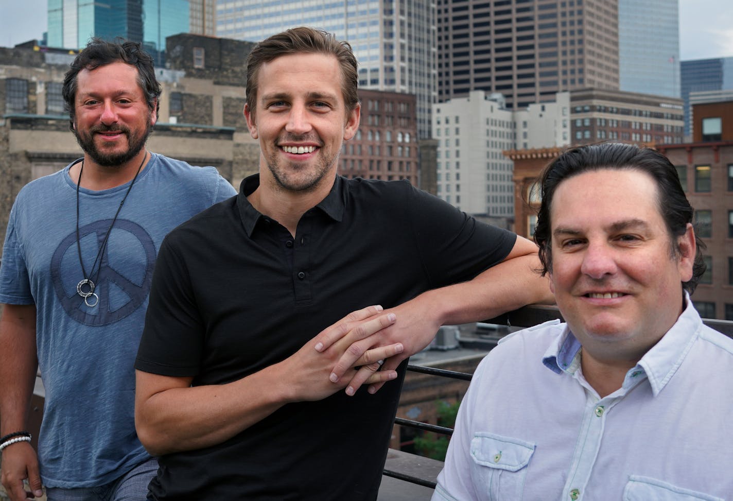 Blake Baratz, Luke Inveiss and Mike Zweugbaum, founders of the Institute for Athletes, on the roof of their building in downtown Minneapolis. brian.peterson@startribune.com Minneapolis, MN Thursday, June 18, 2020