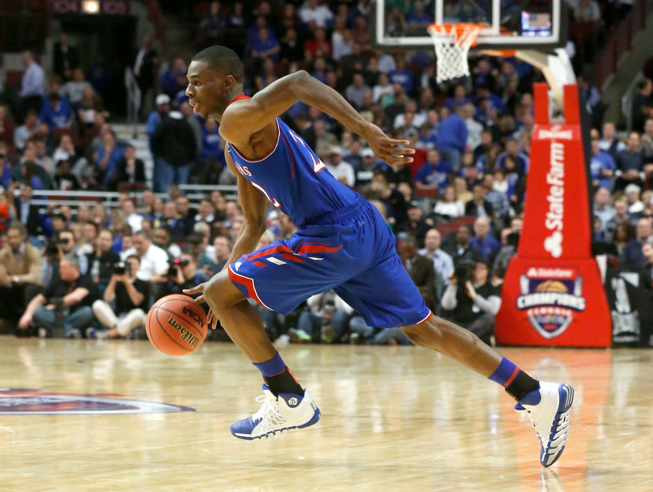 Kansas guard Andrew Wiggins drives to the basket during the second half of an NCAA college basketball game against Duke, Tuesday, Nov. 12, 2013, in Chicago. (AP Photo/Charles Rex Arbogast) ORG XMIT: CXA213