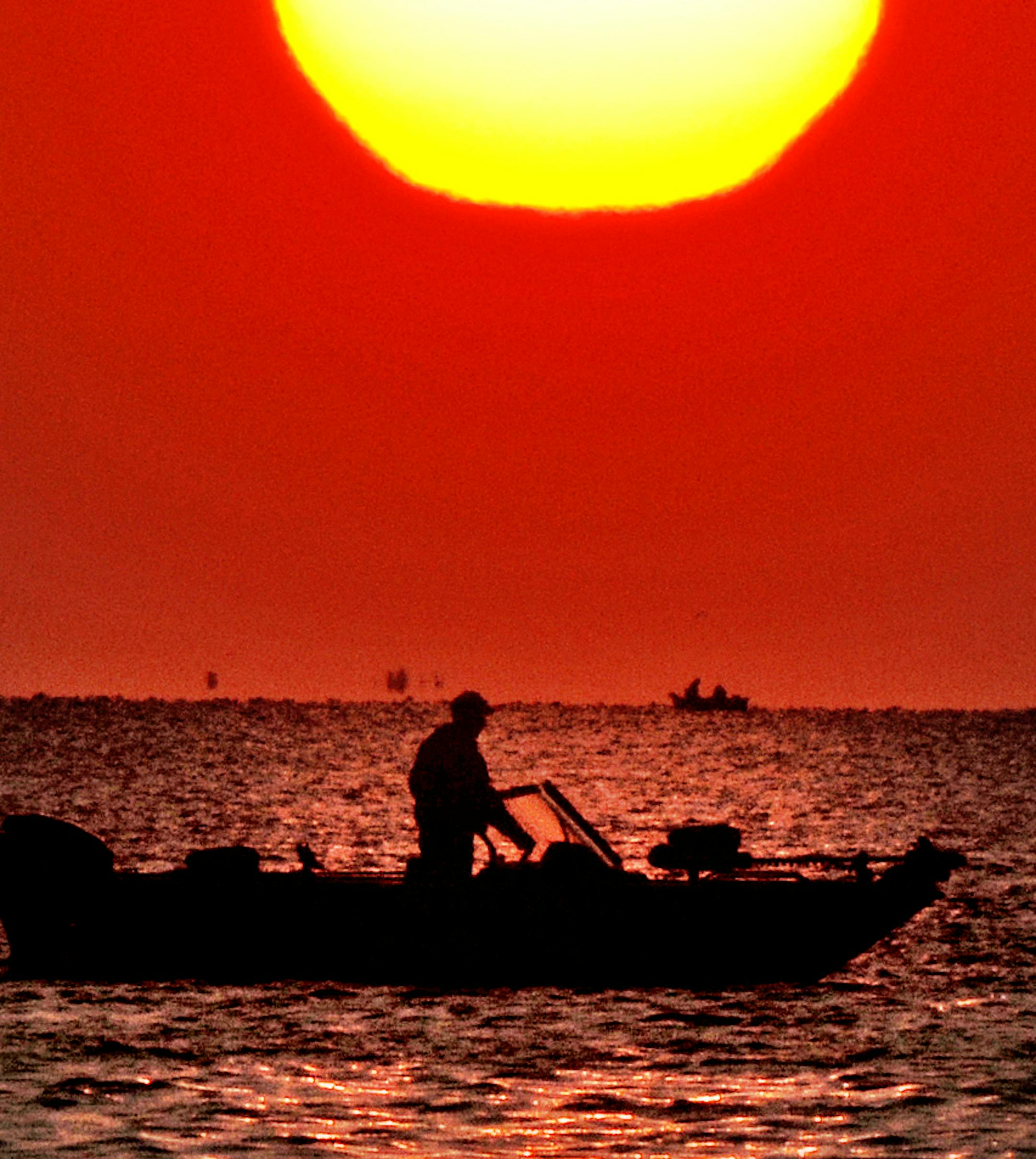 Richard Sennott&#x2022;rsennott@startribune.com] Walker, Mn. Saturday 5/15/10 Fishing opener was sun soaked on Leech Lake in Walker, Mn. These fishermen were working the waters near Pine Point.