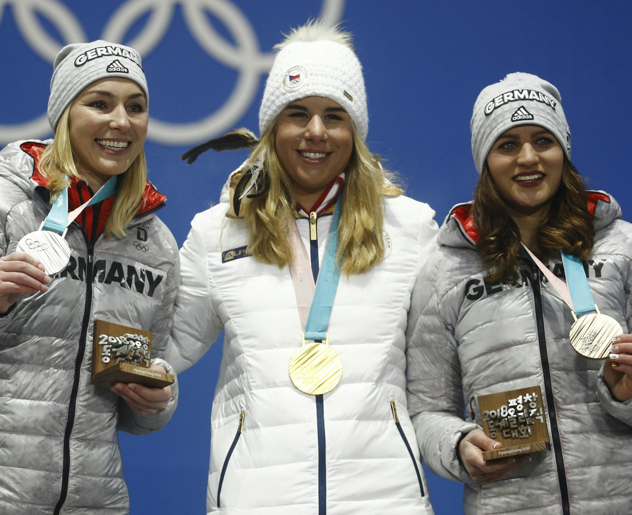 Medalists in the women's parallel giant slalom from left Germany's Selina Joerg, silver, the Czech Republic's Ester Ledecka, gold, and Germany's Ramona Theresia Hofmeister, bronze, pose during their medals ceremony at the 2018 Winter Olympics in Pyeongchang, South Korea, Saturday, Feb. 24, 2018. (AP Photo/Patrick Semansky)