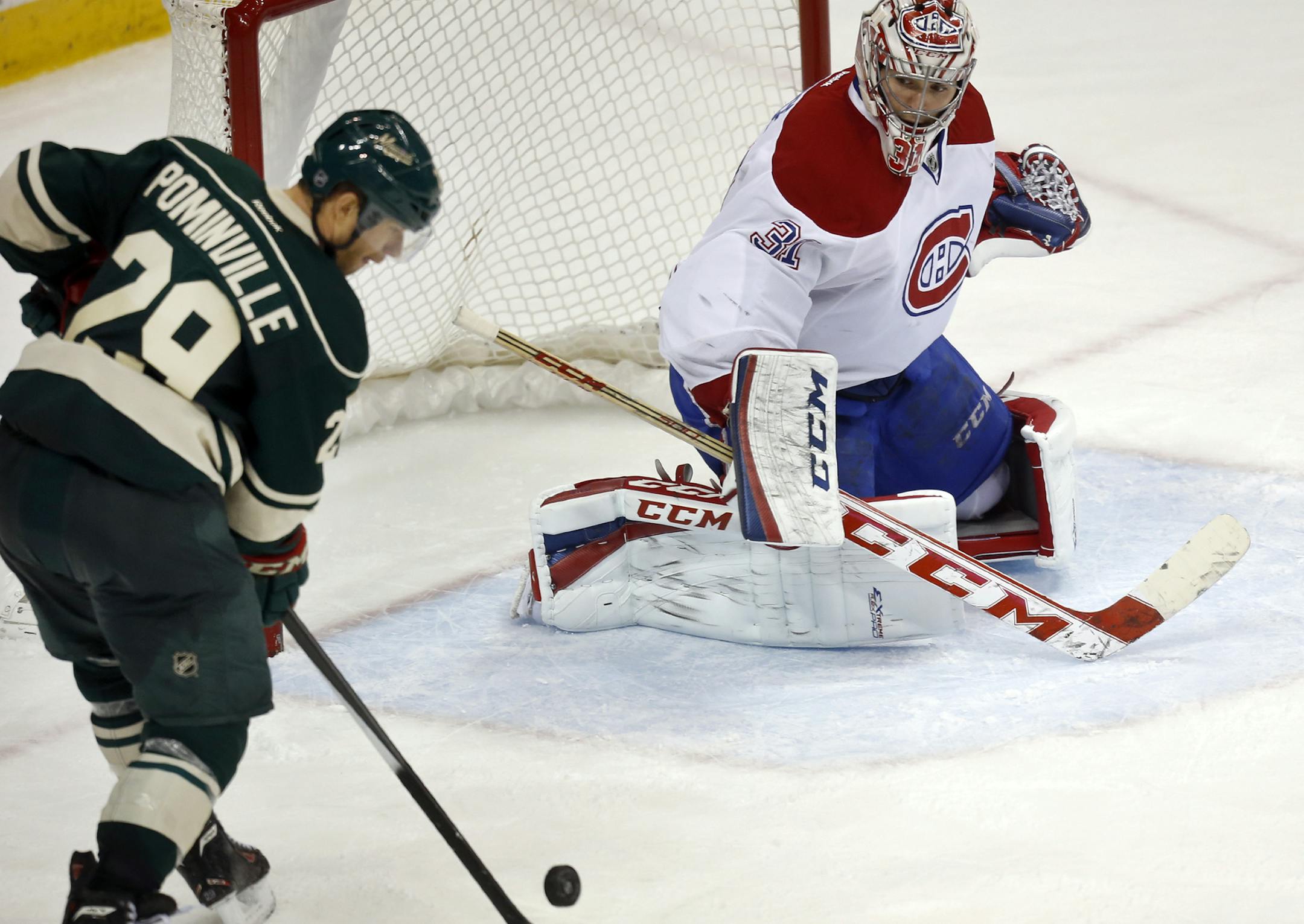 The Minnesota Wild's Jason Pominville (29) scores the game winner past Montreal goalie Carey Price (31) during third period action Friday, Nov. 1, 2013, at the Xcel Energy Center in St. Paul.