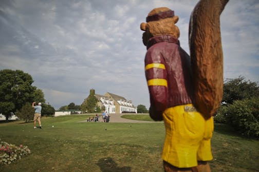 With a statue of Goldie Gopher standing guard, golfers teed off at the University of Minnesota's Les Bolstad cours
