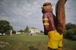 With a statue of Goldie Gopher standing guard, golfers teed off at the University of Minnesota's Les Bolstad cours