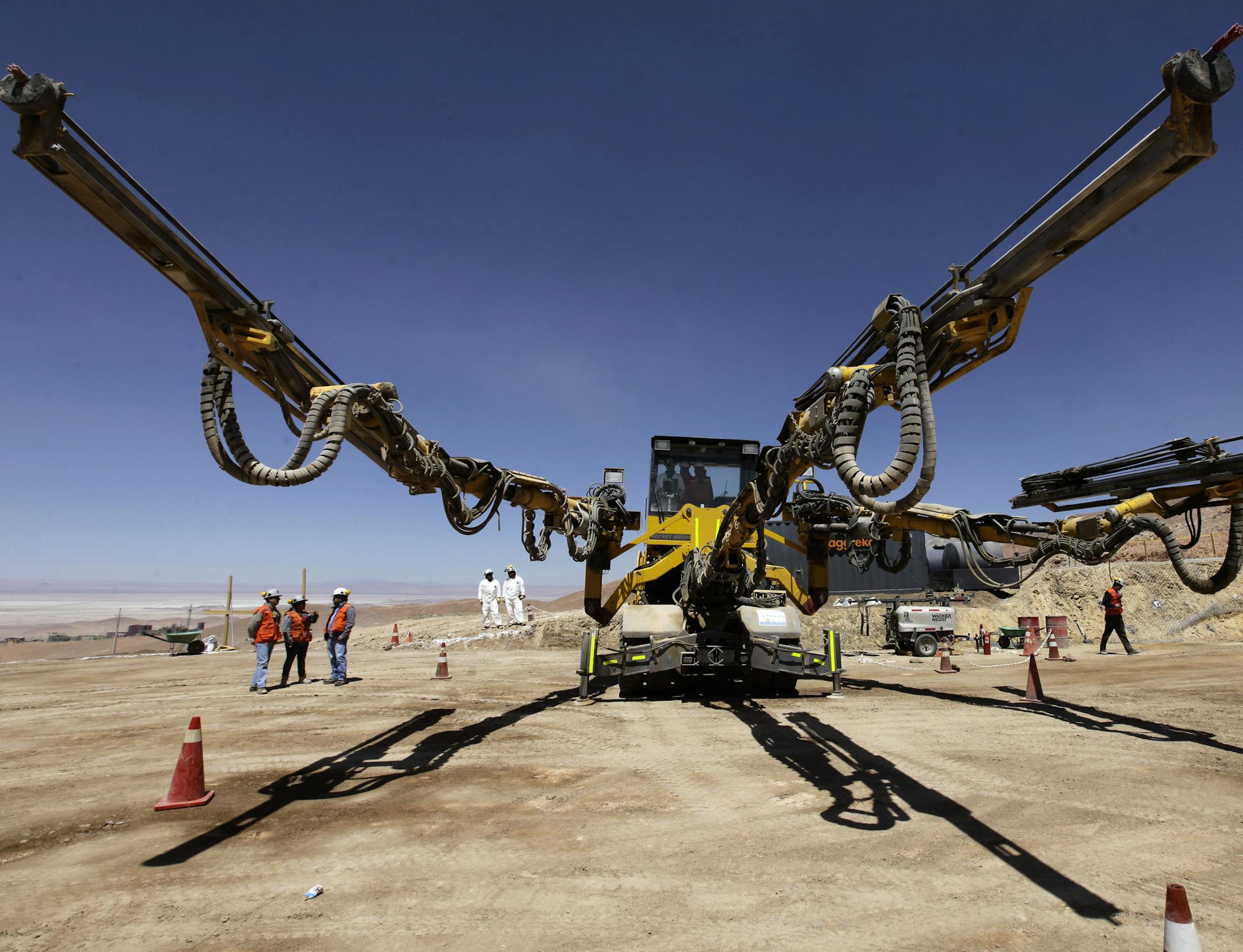 In this Sept. 25, 2012 photo, a multiple perforation machine used to place explosives into rock walls stands at the Chuquicamata copper mine in the Atacama desert in northern Chile. Experts say that by 2019 the Chuquicamata copper mine will be unprofitable, so state-owned mining company Codelco is trying to head off closure by converting the open pit into the world's largest underground mine. Codelco believes the mine still has much more to give, with reserves equal to about 60 percent of all th