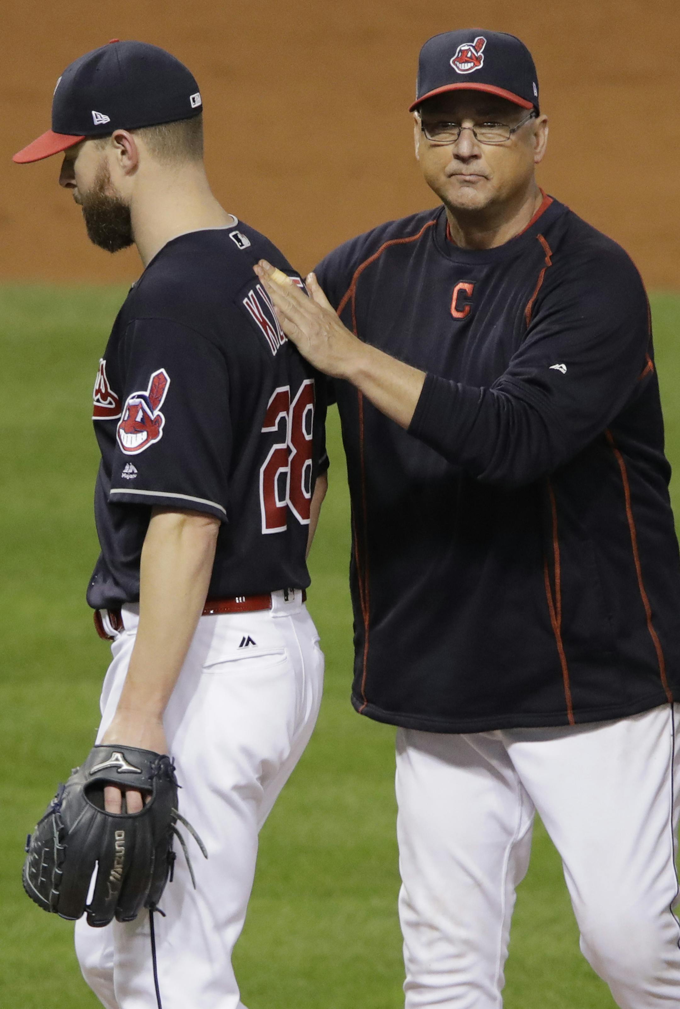 Cleveland Indians manager Terry Francona takes starting pitcher Corey Kluber out of the game during the fifth inning of Game 7 of the Major League Baseball World Series against the Chicago Cubs Wednesday, Nov. 2, 2016, in Cleveland. (AP Photo/Gene J. Puskar)