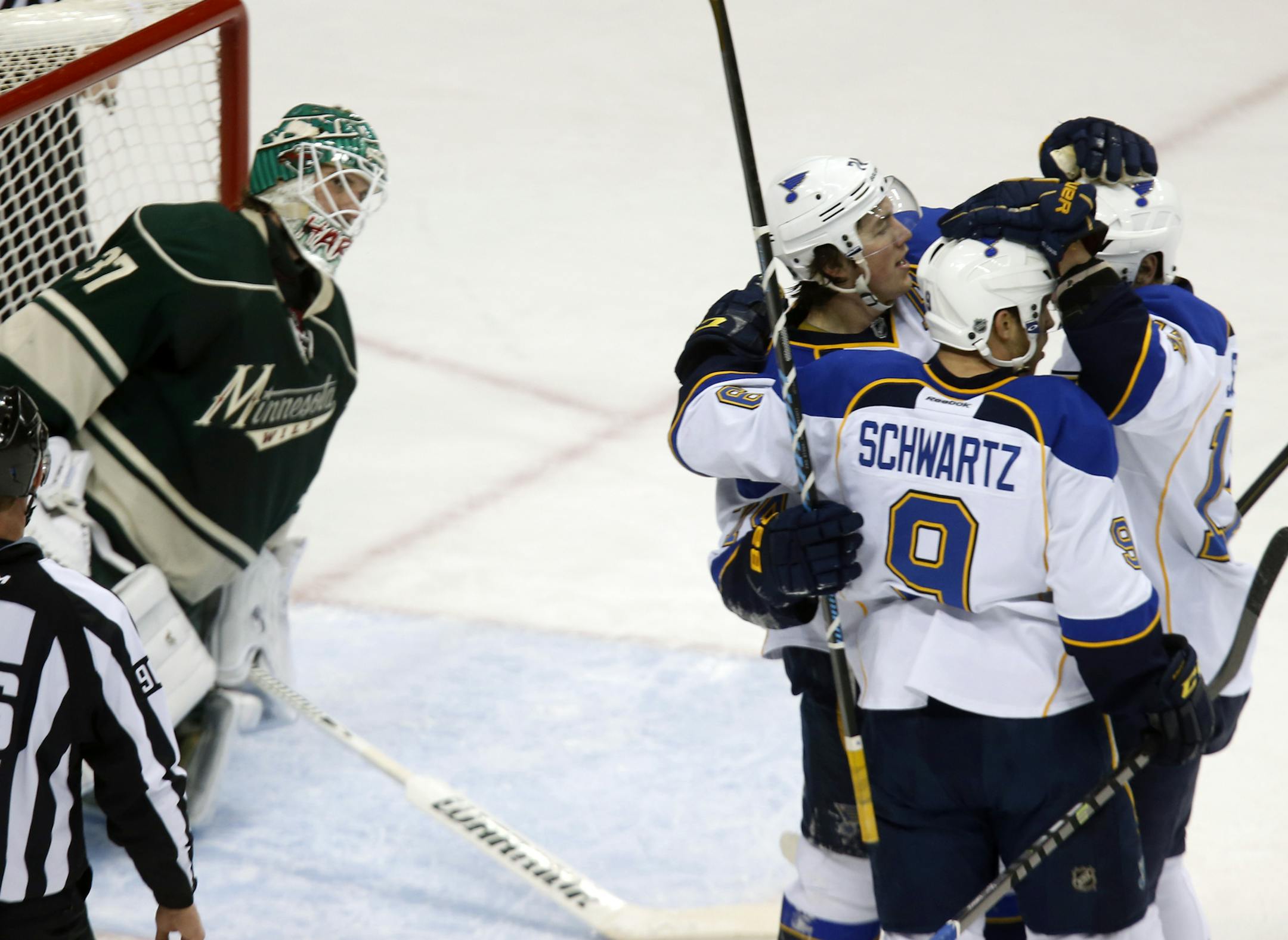 Former Warroad star T.J. Oshie, center, who scored St. Louis' first goal, celebrated with Jaden Schwartz on his second-period goal during the Blues' 2-1 victory Tuesday.