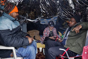 From left, Seneca Morris, Jennia Dumont and Mandla Xaba talked with each other as they started their day inside a dwelling they built at the Near Nort