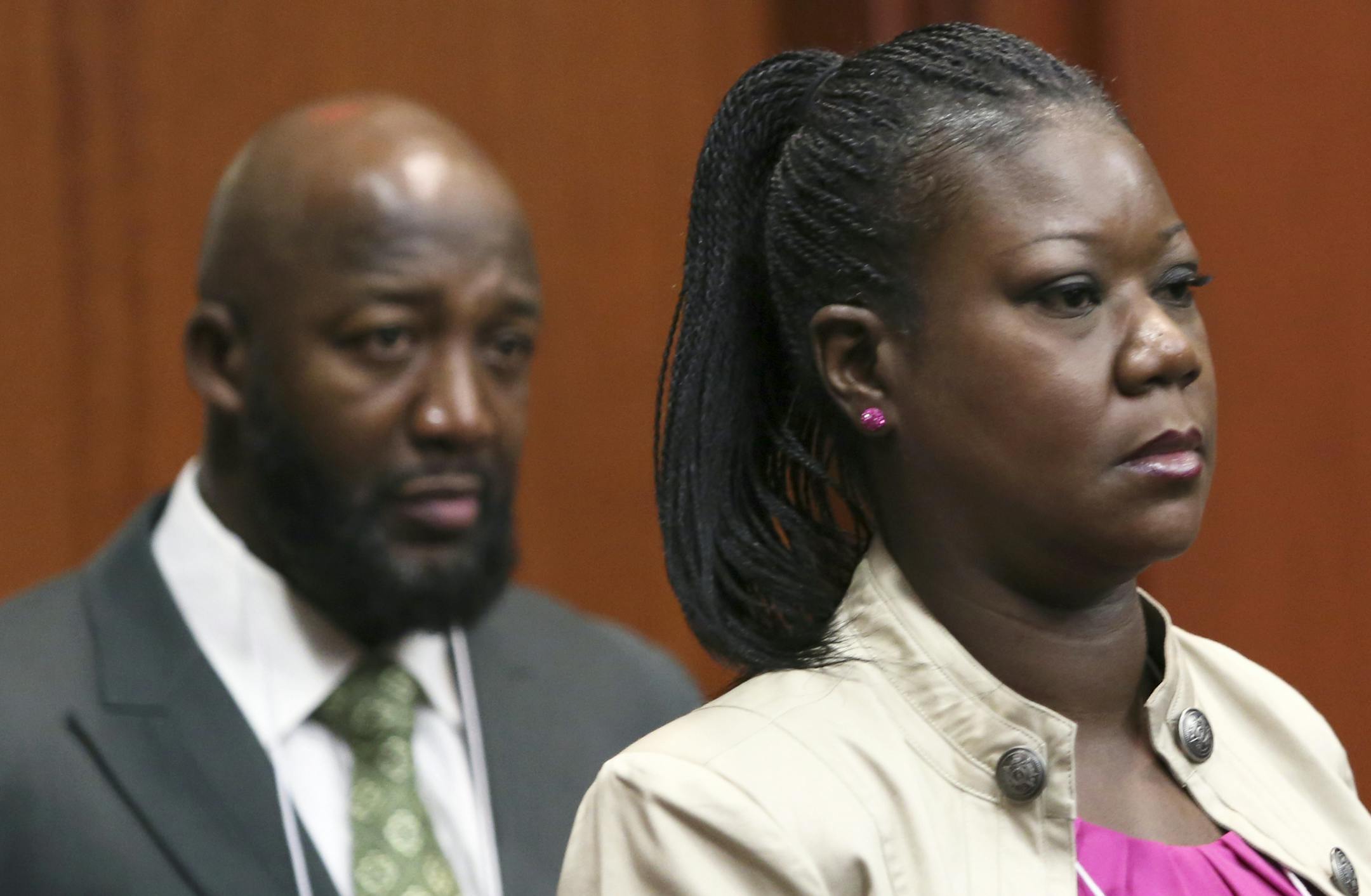 Trayvon Martin's parents, Tracy Martin, left, and Sybrina Fulton, enter the courtroom during George Zimmerman's trial in Seminole County circuit court in Sanford, Fla. Tuesday, June 25, 2013