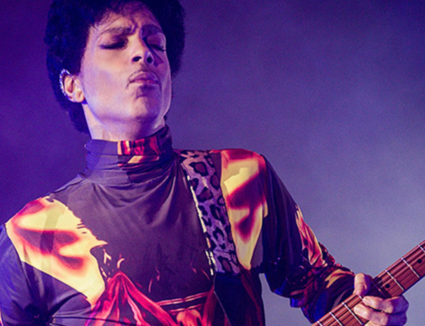 This Fall 2012 publicity photo provided by Rogers and Cowan shows musician Prince performing in concert in Chicago. Prince turns off the lights at South by Southwest on Saturday, March 16, 2013, with an unexpected and intimate showcase that ranks among the biggest surprises in years at the star-studded music festival and conference. (AP Photo/Rogers and Cowan) ORG XMIT: MIN2013050816502320 ORG XMIT: MIN1305081652431225 horizontal crop for online. dd ORG XMIT: MIN1310061626262014