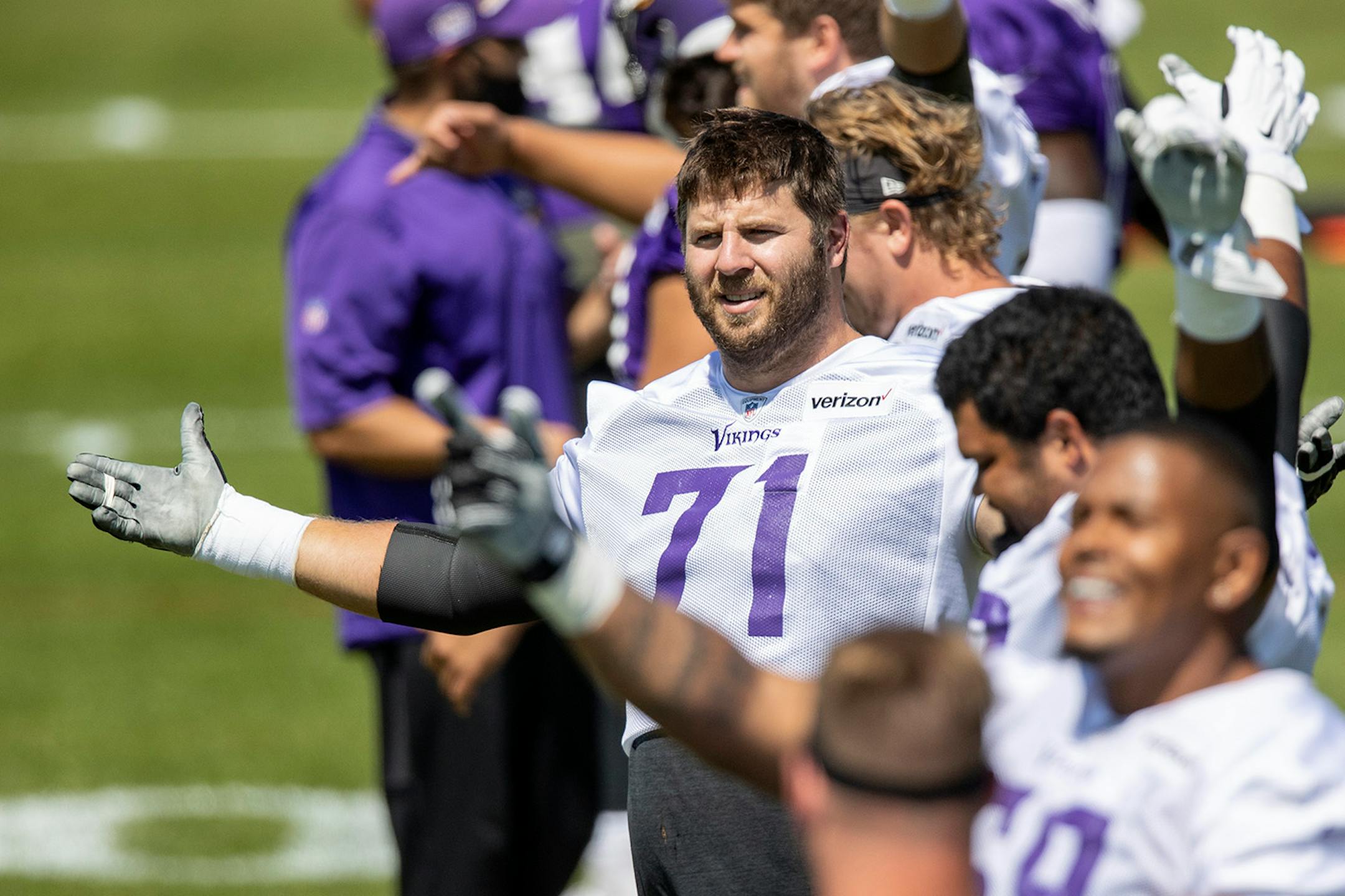 Minnesota Vikings offensive lineman Riley Reiff (71) stretched during practice.