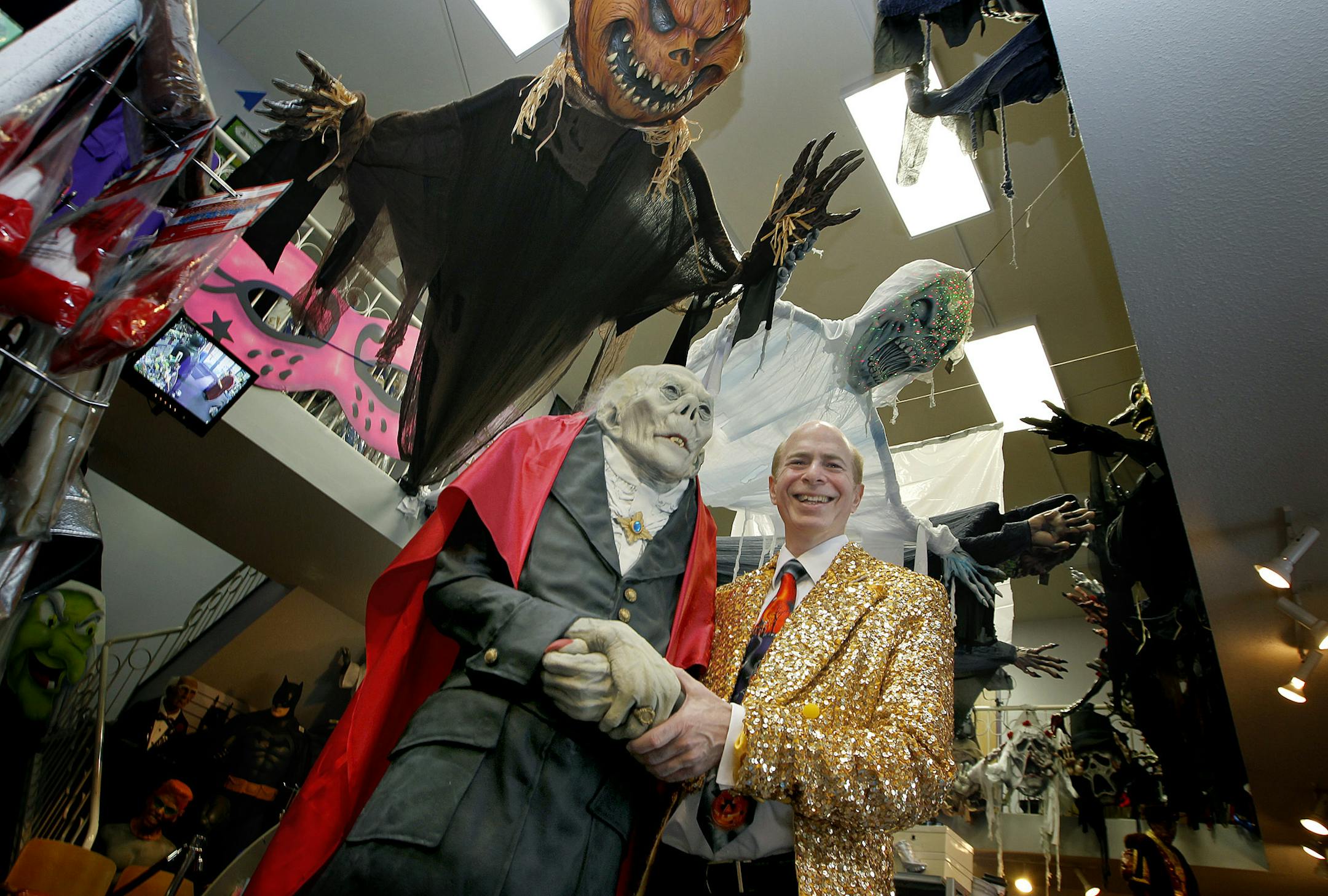 Twin Cities Magic & Costume co-owner Jim Berg stood in the midst of the many costumes and decorations at the store, Friday, October 4, 2013 in West St. Paul, MN. The legendary costume shop that operated in downtown St. Paul for a quarter-century, is entering its first Halloween season after closing its downtown shop and moving all operations to a spot on Robert Street in West St. Paul. (ELIZABETH FLORES/STAR TRIBUNE) ELIZABETH FLORES • eflores@startribune.com