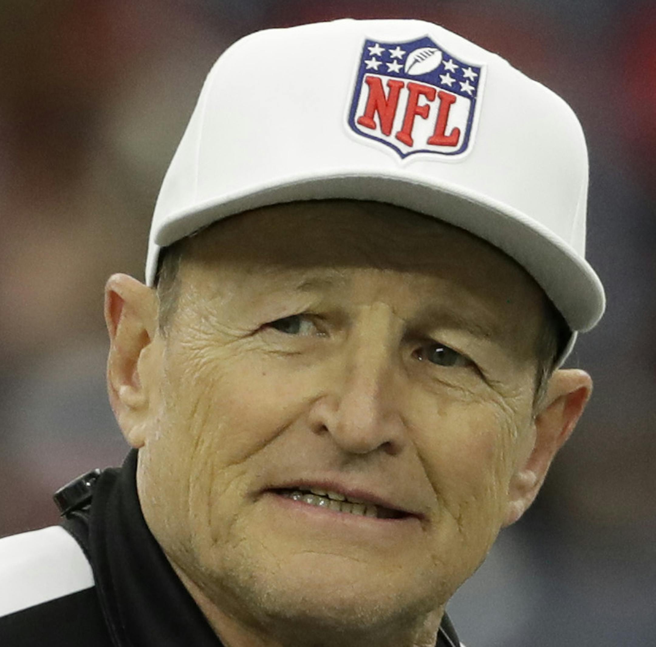 referee Ed Hochuli (85) talks with side judge Alex Kemp (55) before an NFL football game Sunday, Dec. 18, 2016, in Houston. (AP Photo/David J. Phillip)