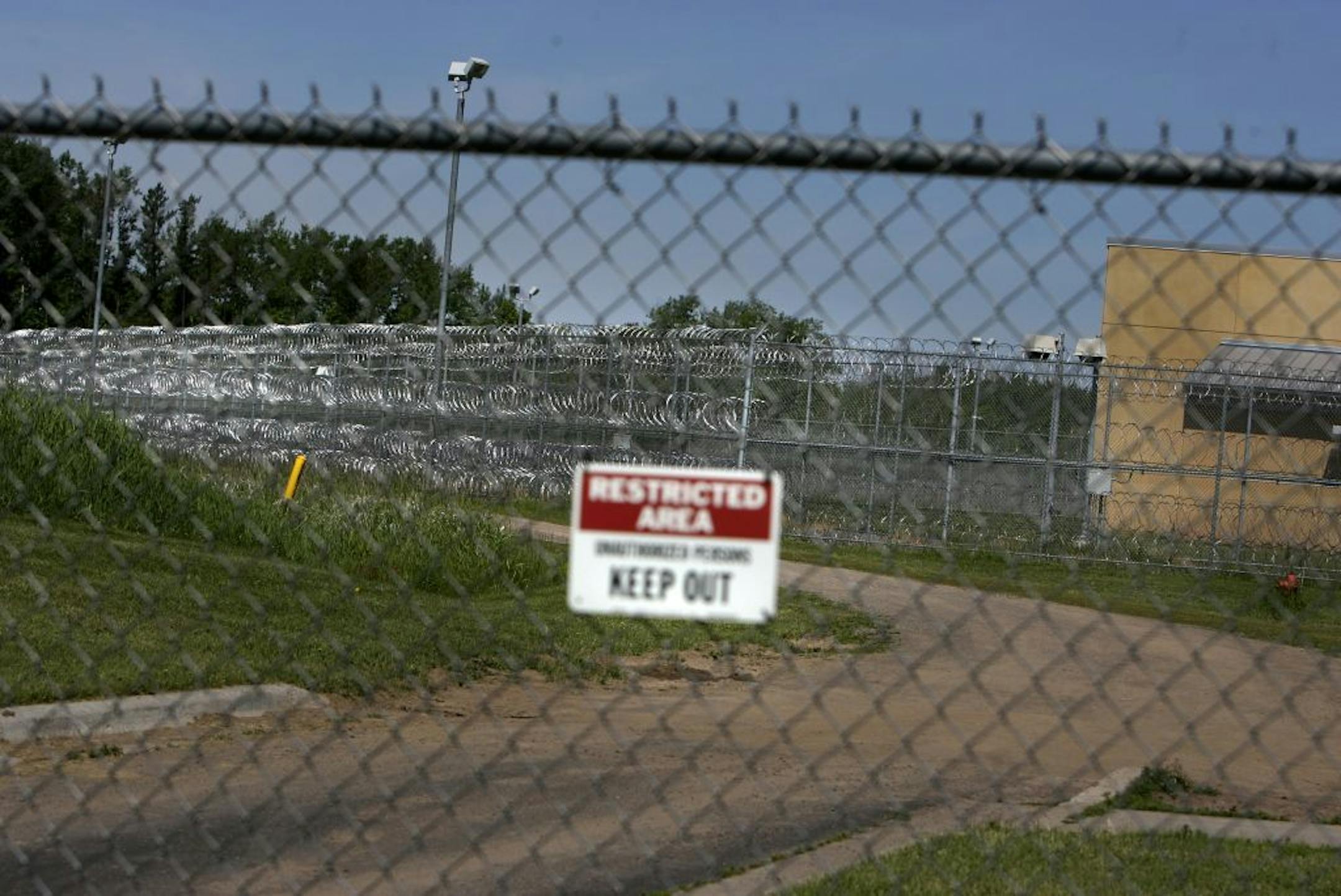 ELIZABETH FLORES � eflores@startribune. The current Minnesota Department of Human Services Sex Offender Program building is surrounded by wire and fences in Moose Lake, MN, Monday, June 12, 2006. The program has grown too small for the amount of offenders that are coming in.