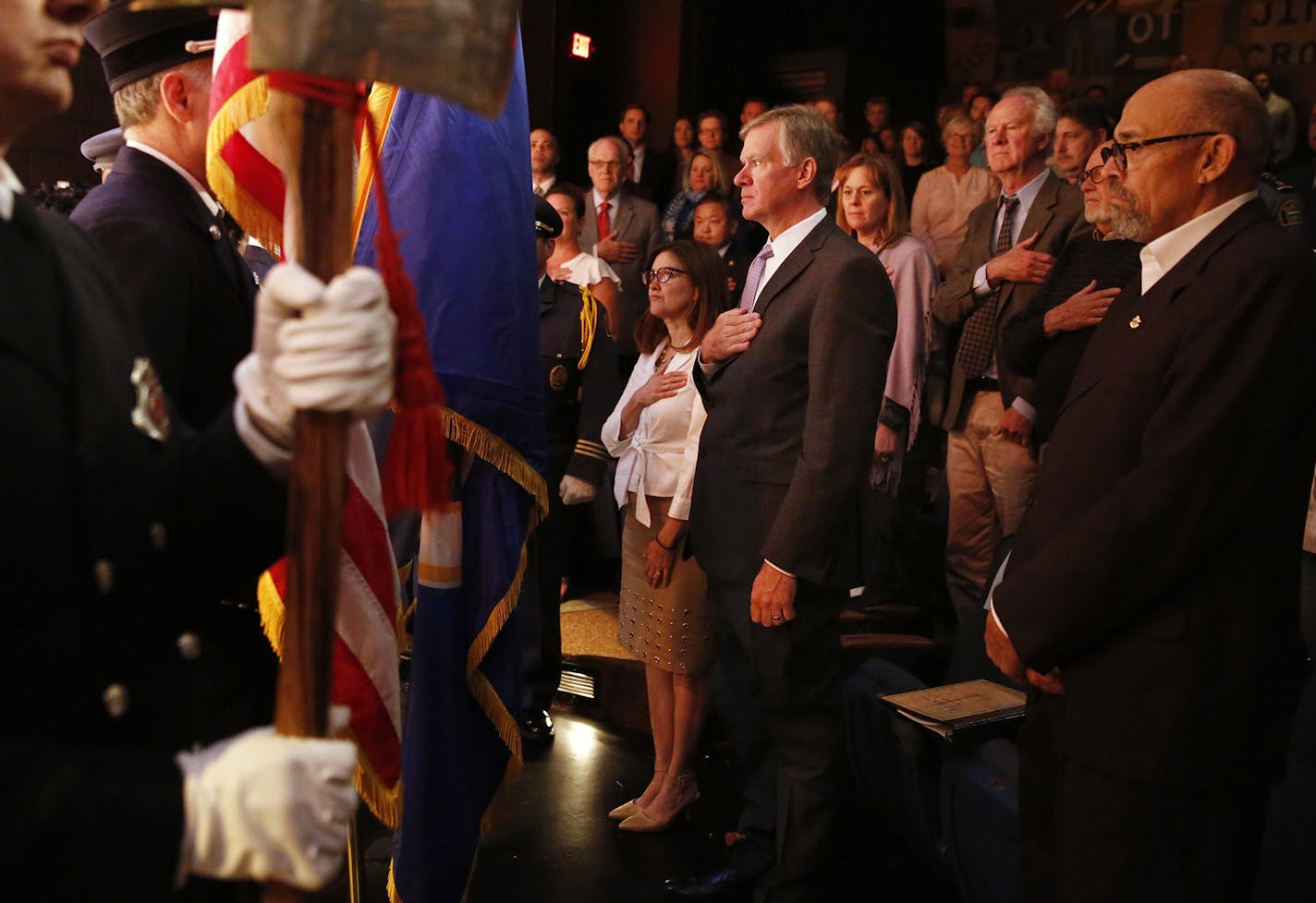 St. Paul Mayor Chris Coleman stands for the National Anthem before his State of the City speech at the Penumbra Theatre. ] (Leila Navidi/Star Tribune) leila.navidi@startribune.com BACKGROUND INFORMATION: St. Paul Mayor gives his 2016 State of the City address Tuesday, April 19, 2016 at the Penumbra Theatre in St. Paul. Interspersed in the speech were performances of excerpts of August Wilson plays.