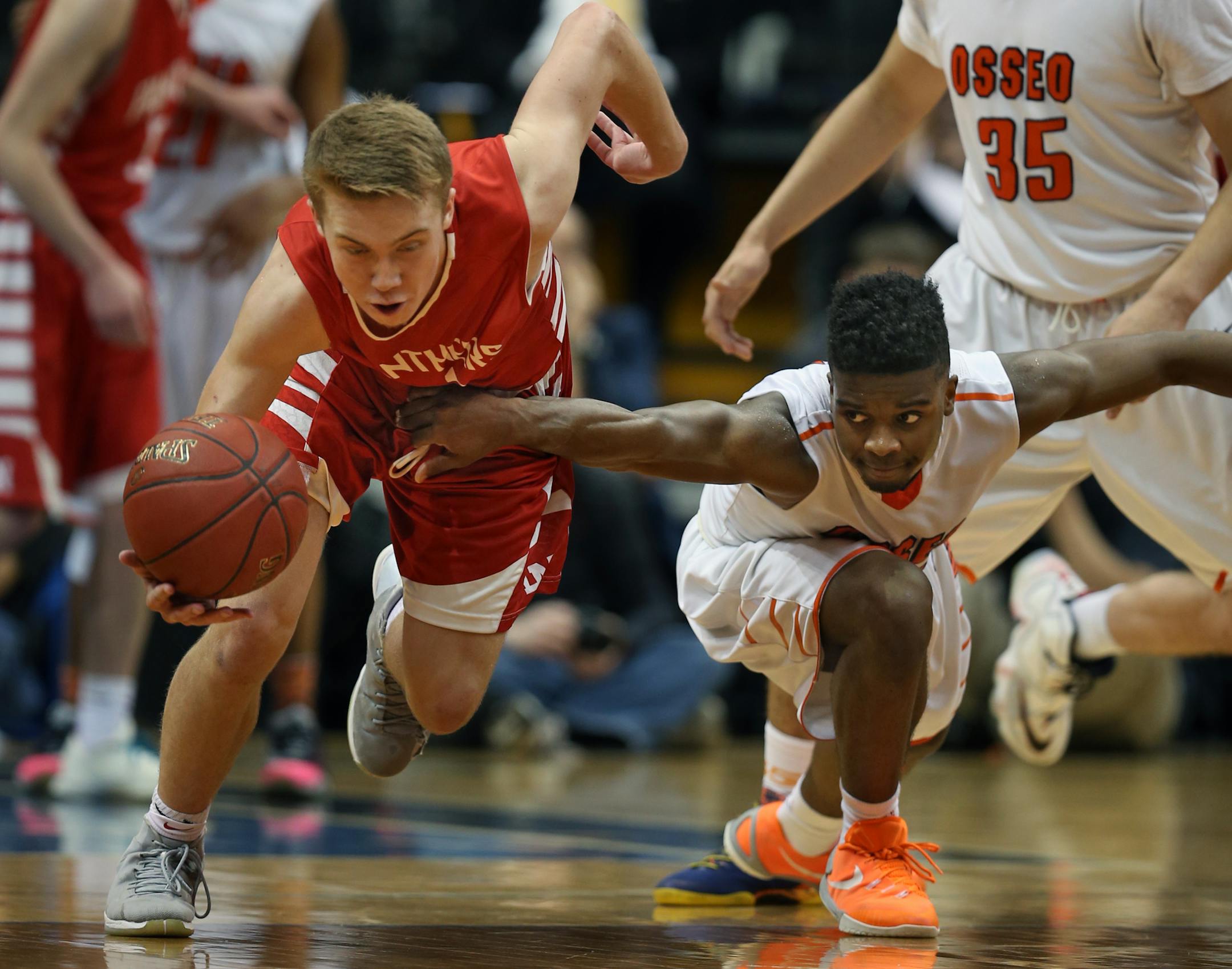 Nick Fossey(4) makes a key steal late in the game against Allan Anderson(12) of Osseo.] At Target Center in 4A quarterfinal game between Osseo H.S. and Lakeville North H.S. Richard Tsong-Taatarii/rtsong-taatarii@startribune.com