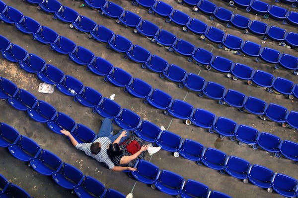 Minneapolis, MN 8/29/2002 End of the Season??? Fans linger in the metrodome seats long after the Twins were defeated by Seattle Thursday afternoon. A 