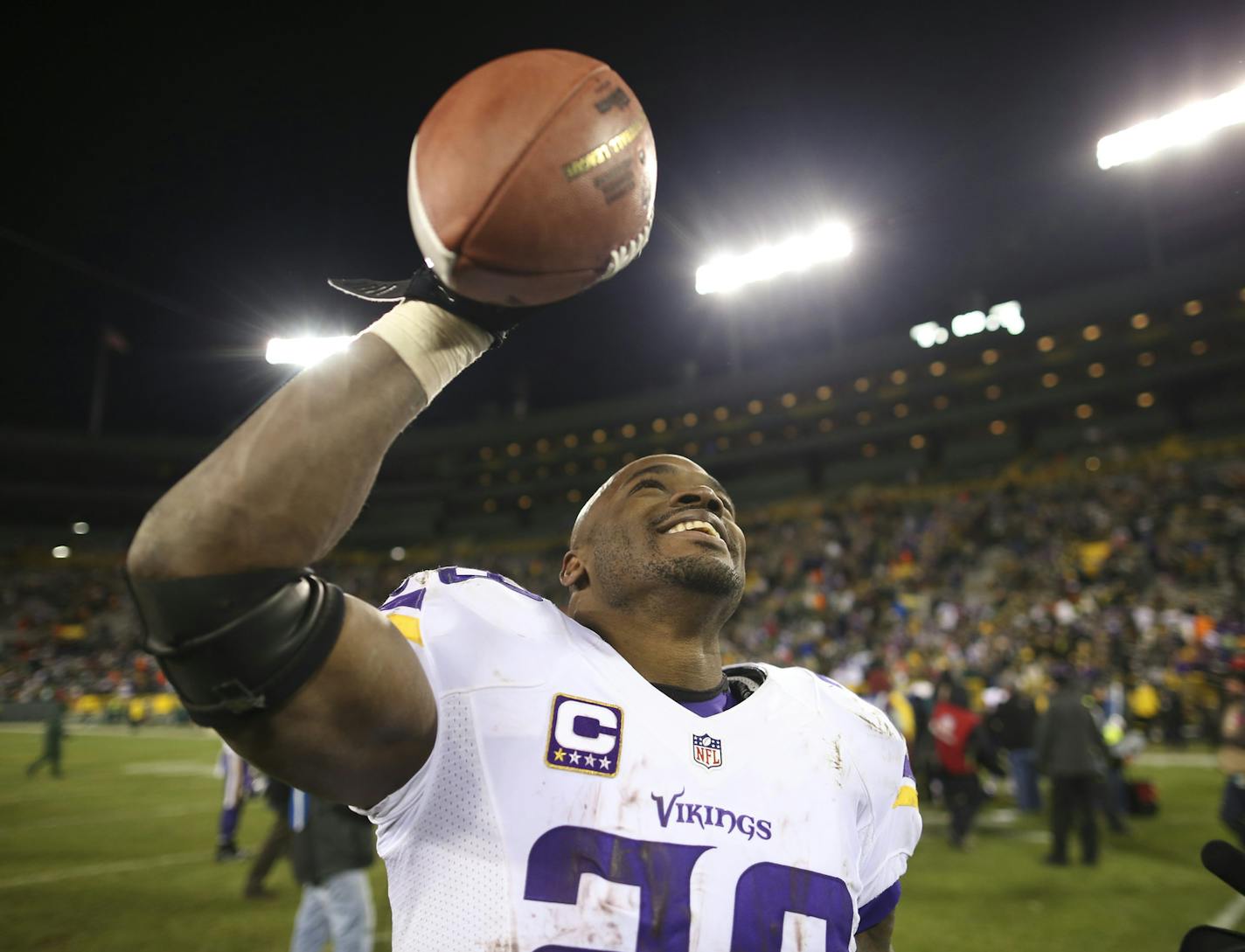 Adrian Peterson held the game ball as he walked off the field after the Vikings defeated Green Bay in January 2016 to win the NFC North. Peterson will not return to the Vikings for the 2017 season.