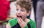 Second-grader Jude Kresl reacted to the spice level in the kimchi.