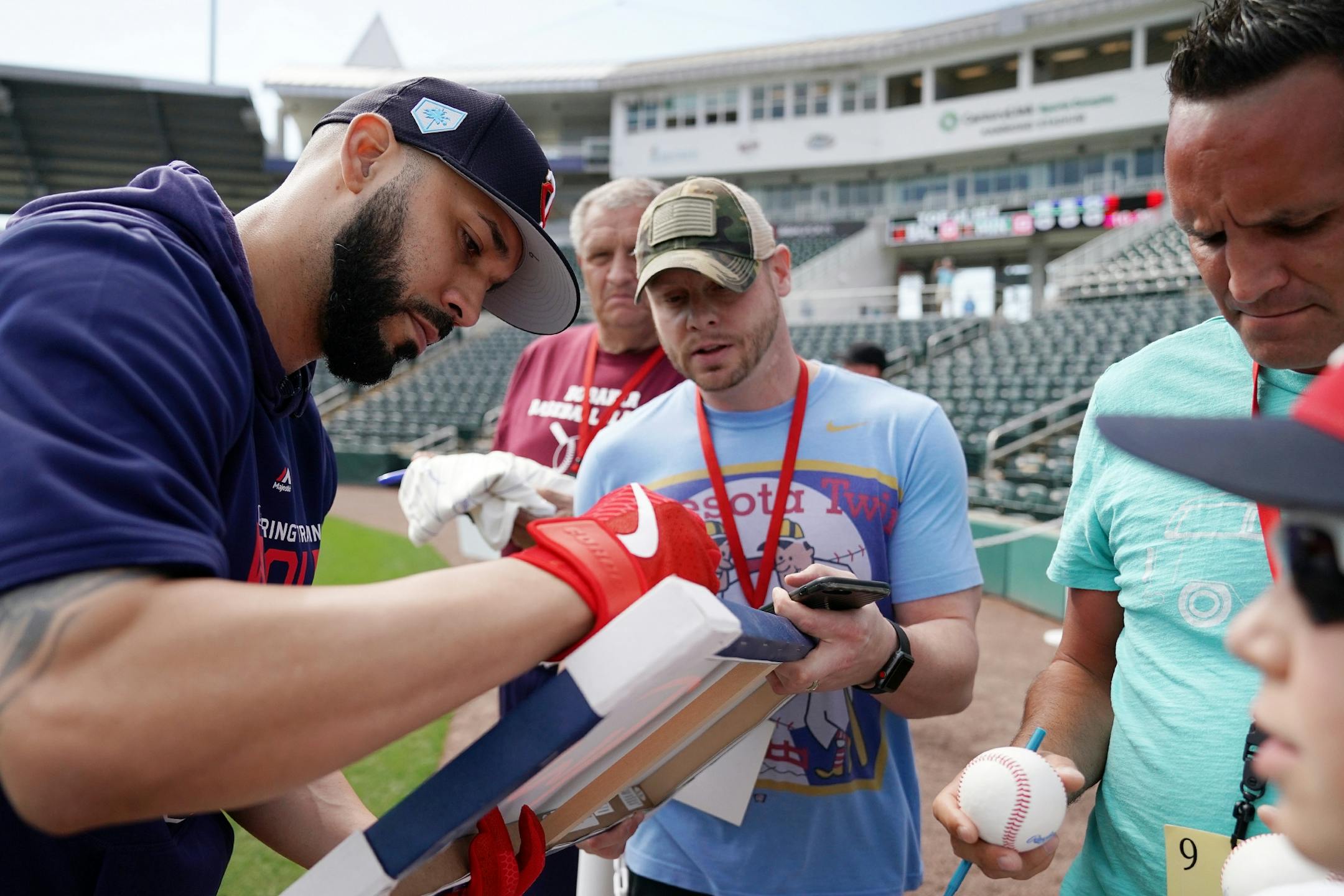 Newly acquired Minnesota Twins utility player Marwin Gonzalez (9) stopped to sign autographs before batting practice Monday morning.