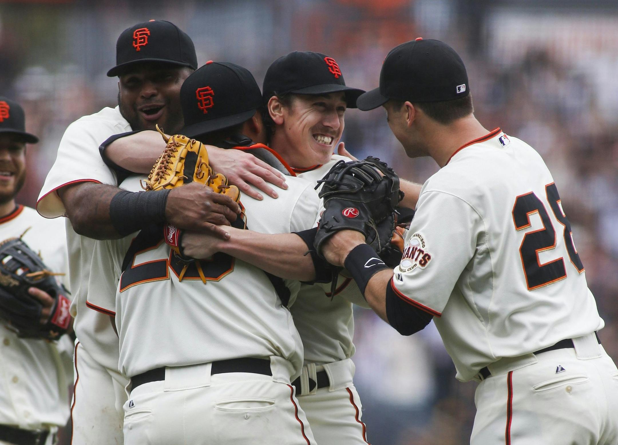 Giants teammates surrounded Tim Lincecum, center, after the two-time Cy Young Award winner no-hit the Padres for the second time in less than a year. Lincecum also had two hits in host San Francisco&#x2019;s 4-0 victory Wednesday.