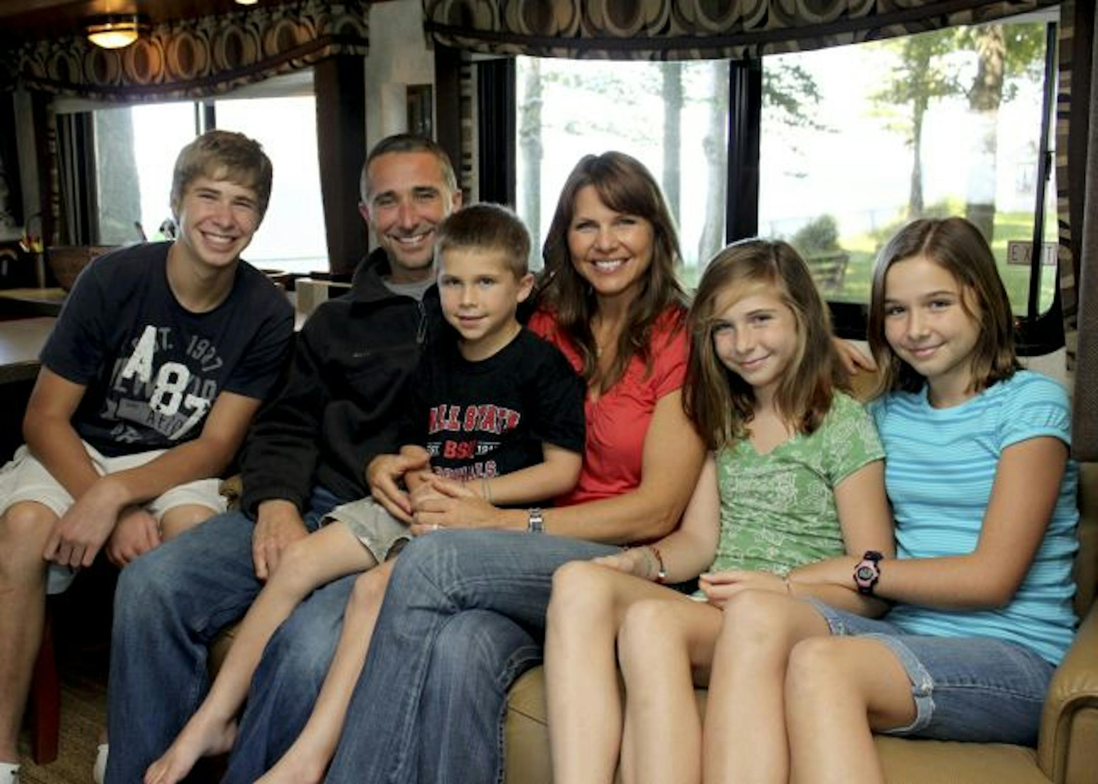 The Loecken family in their RV, from left, Ben, Jay, Noah, Beth, Abigail and Bekah.