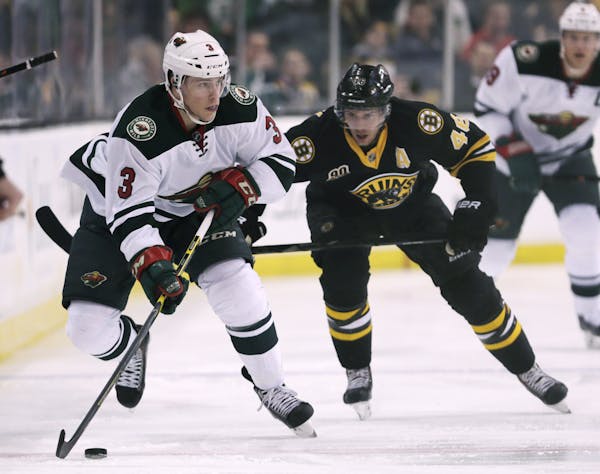 Minnesota Wild center Charlie Coyle (3) looks to pass as he skates by Boston Bruins center David Krejci (46) during the first period of an NHL hockey 