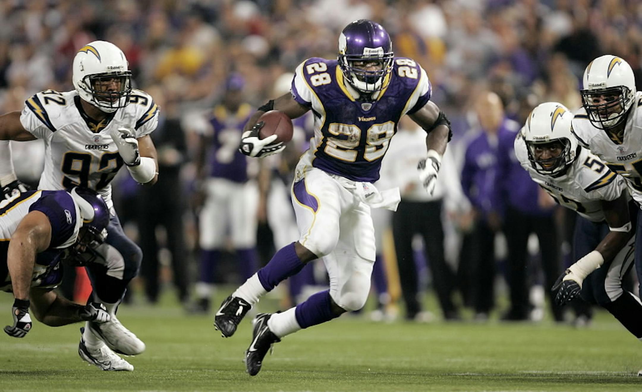 Minnesota Vikings running back Adrian Peterson, (28) races down field during a 46-yard touchdown run in the fourth quarter against the San Diego Chargers on Nov. 4, 2007. He gained 296 yards that day, which is still an NFL record.