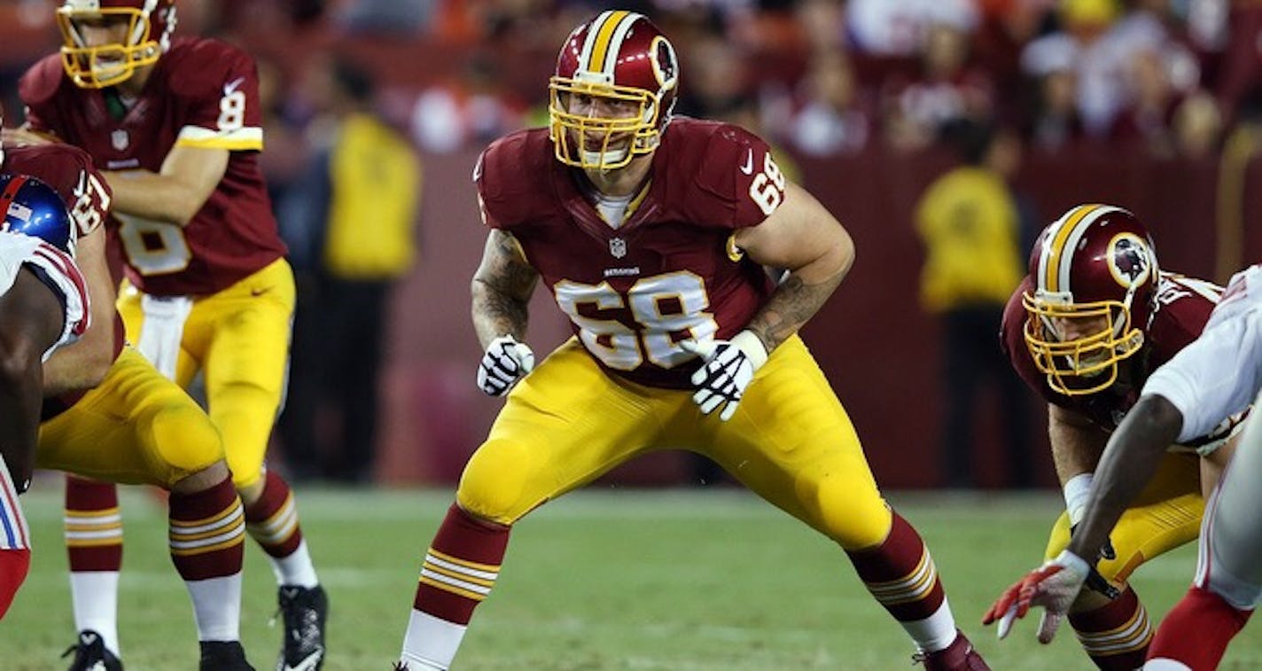 Washington Redskins tackle Tom Compton (68) blocks during the NFL week 4 regular season football game against the New York Giants on Thursday, Sept. 25, 2014 in Landover, Md. The Giants won the game 45-14. (AP Photo/Paul Spinelli)