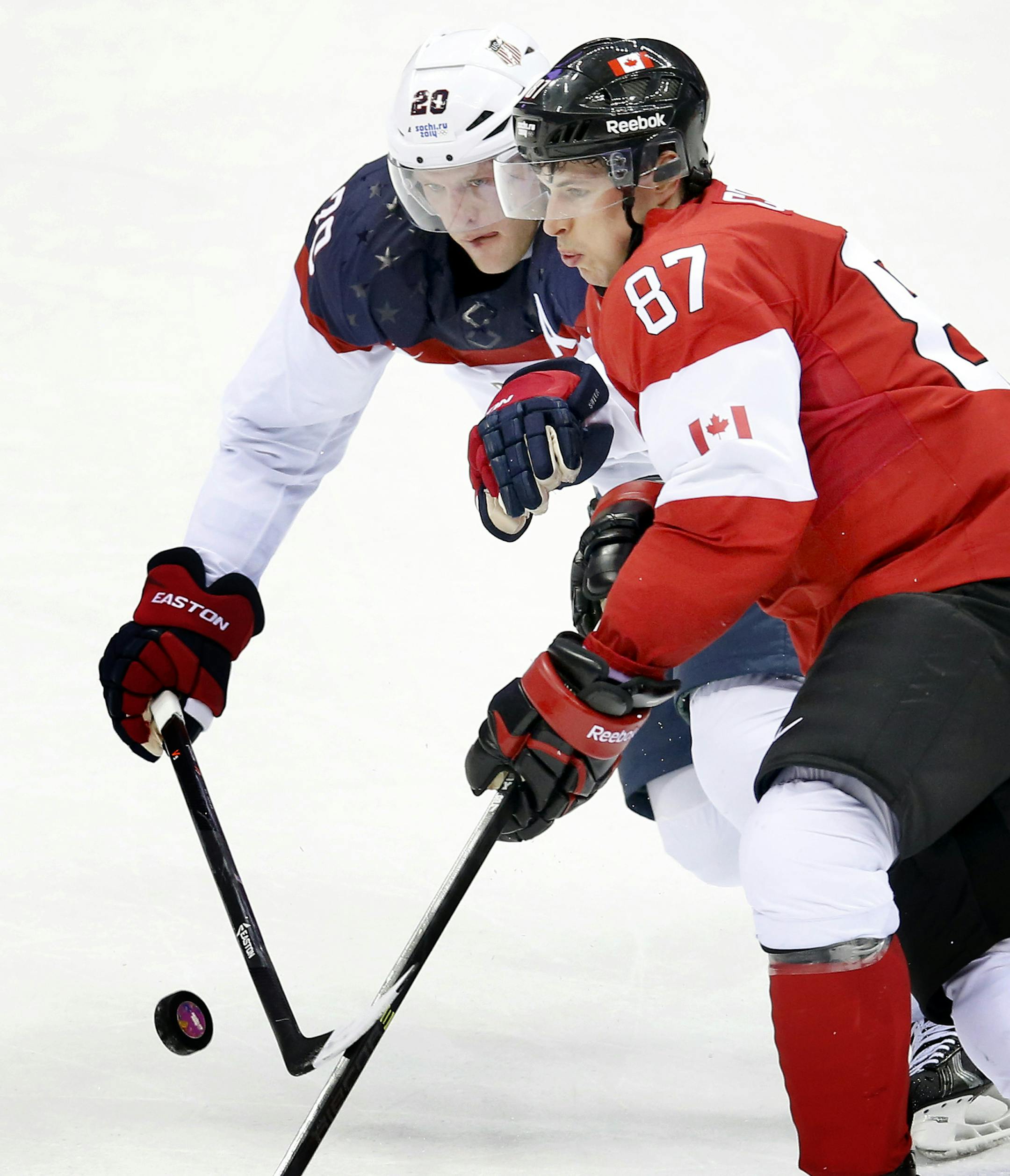 Ryan Suter (20) and Sidney Crosby (87) fought for the puck in the second period. Canada beat USA 1-0. ] CARLOS GONZALEZ cgonzalez@startribune.com - February 21, 2013, Sochi, Russia, Sochi 2014 Winter Olympics, Bolshoy Ice Dome, men's hockey semifinal, USA vs. Canada ORG XMIT: MIN1402211417054307