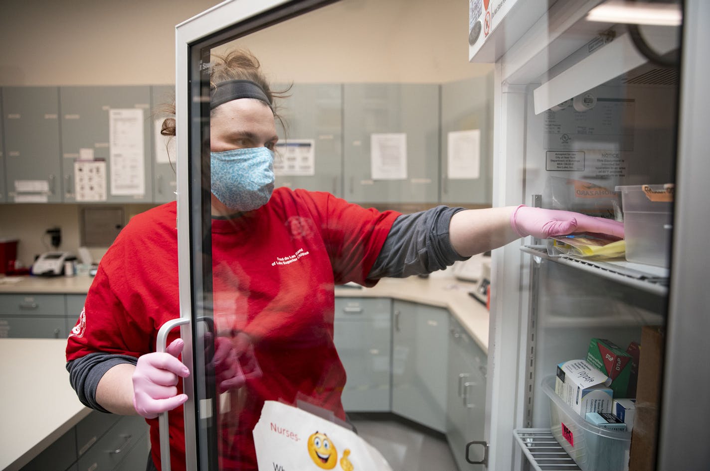 Beth Thomsen, MLS placed a COVID-19 nasal swab test in a freezer. The sample came from the drive thru testing site at the Min No Aya Win clinic on Wednesday May 6, 2020. ] ALEX KORMANN • alex.kormann@startribune.com The Min No Aya Win clinic on the Fond Du Lac reservation has seen a small amount of patients on a daily basis as they prepare for a wave of COVID-19 cases to hit their area. Dr. Vainio MD, a member of the Mille Lacs Band of the Ojibwe tribe has worked at the clinic for decades and ha