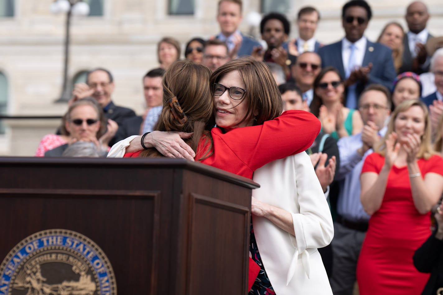 Senate Majority Leader Kari Dziedzic, DFL-Minneapolis, got a hug from Lt. Gov. Peggy Flanagan.